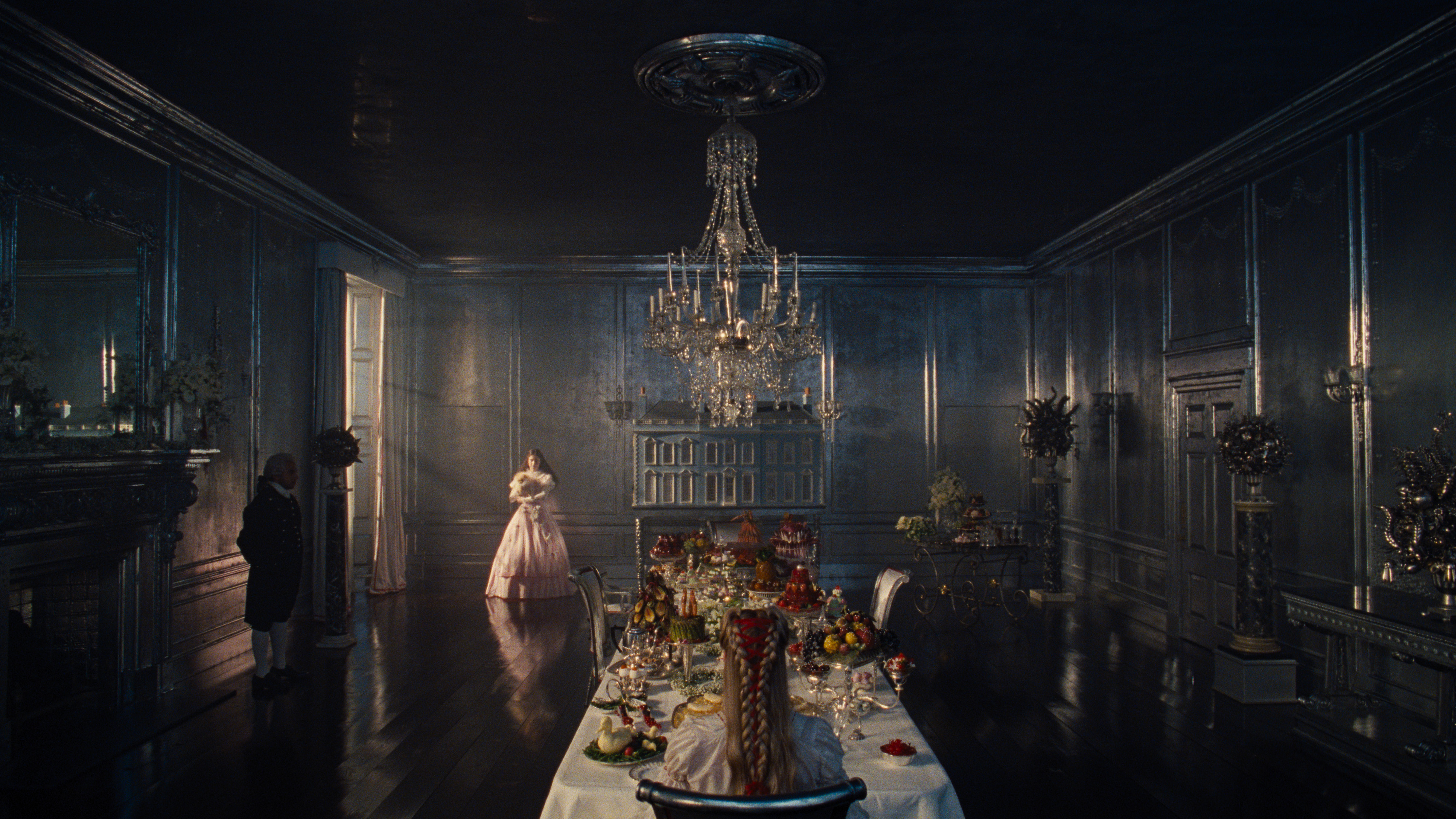 a scene in the dining room from emerald fennel wuthering heights with margot robbie