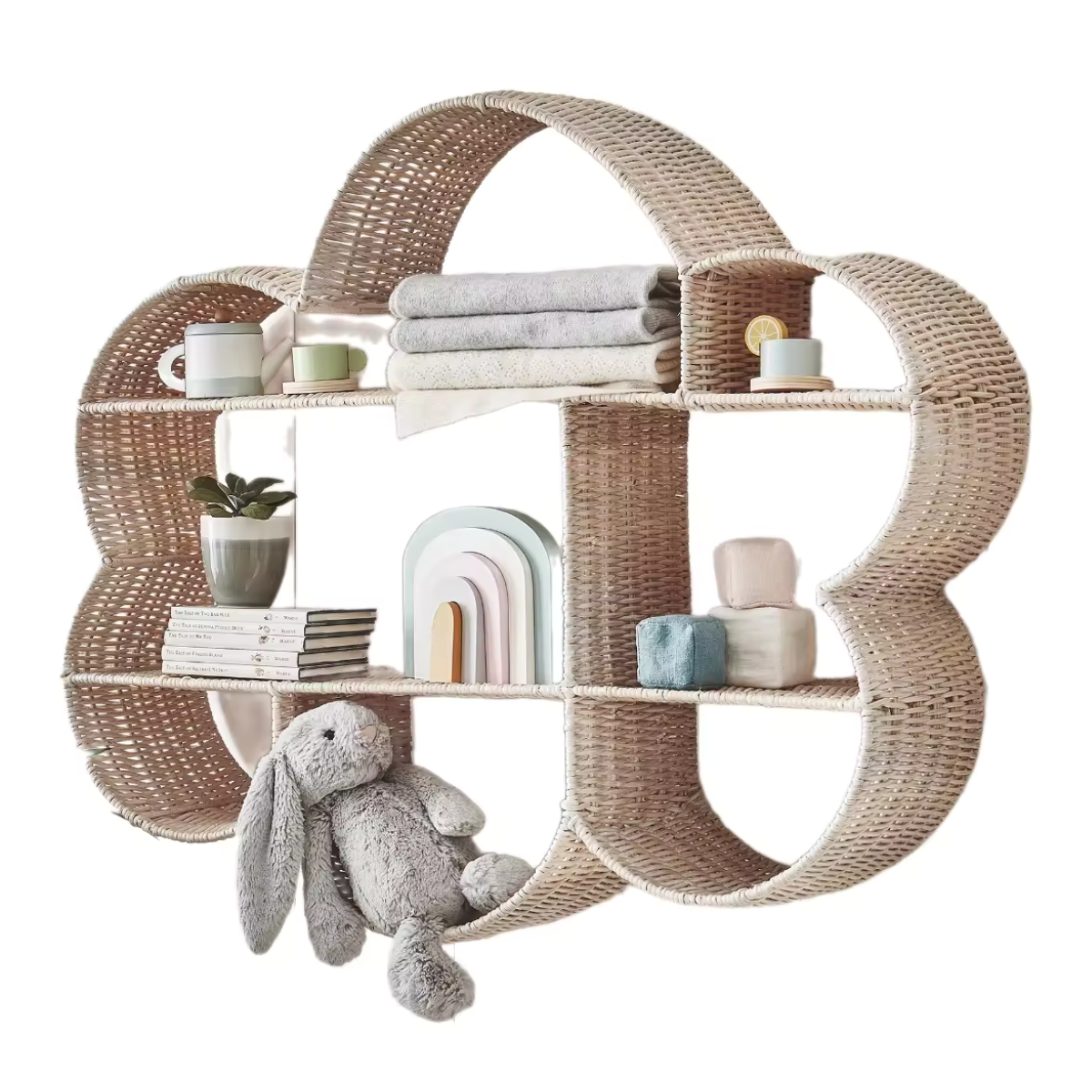 a rattan cloud shape bookshelf with books and toys