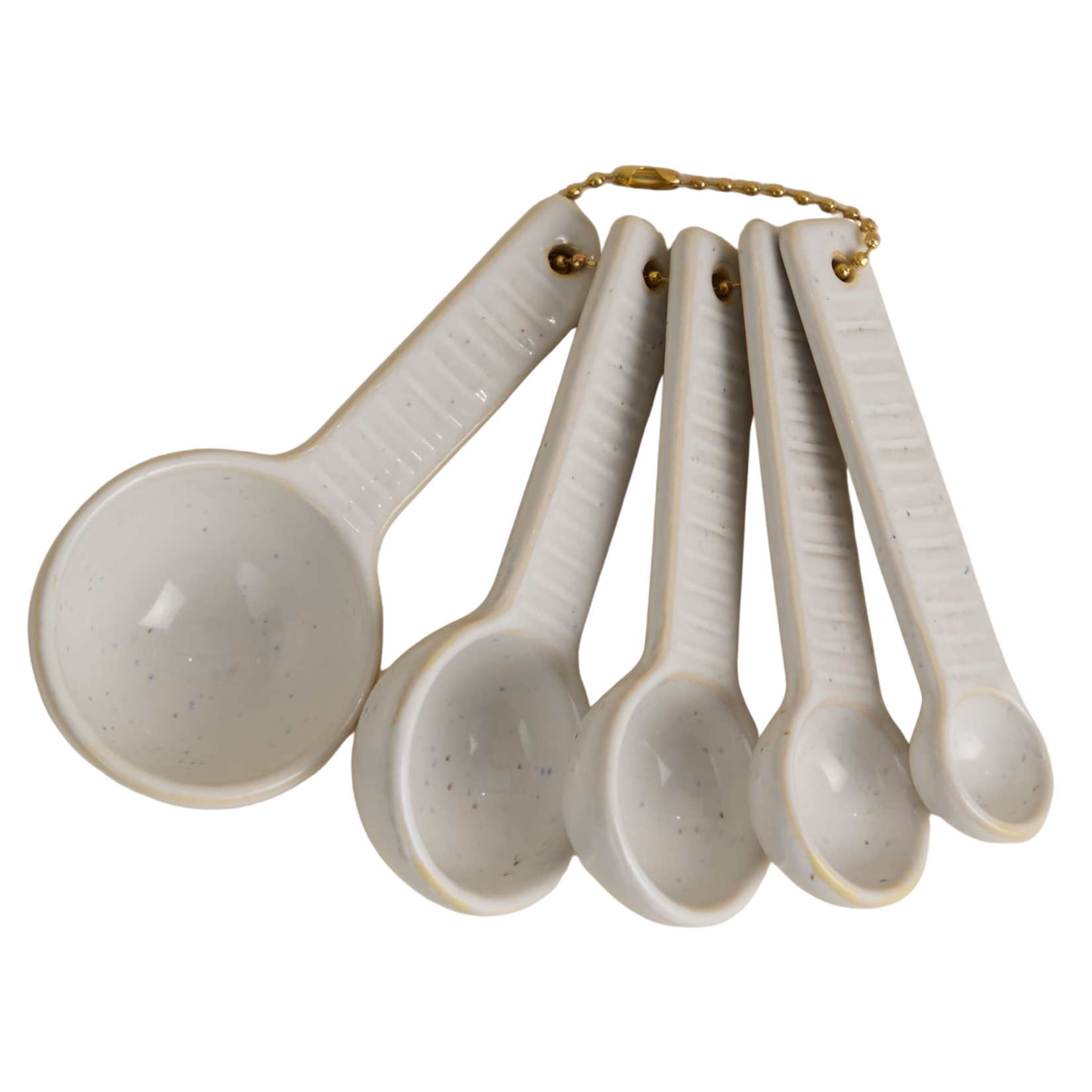 Set of speckled cream ceramic measuring spoons with ribbed handles, held together on a brass ball chain