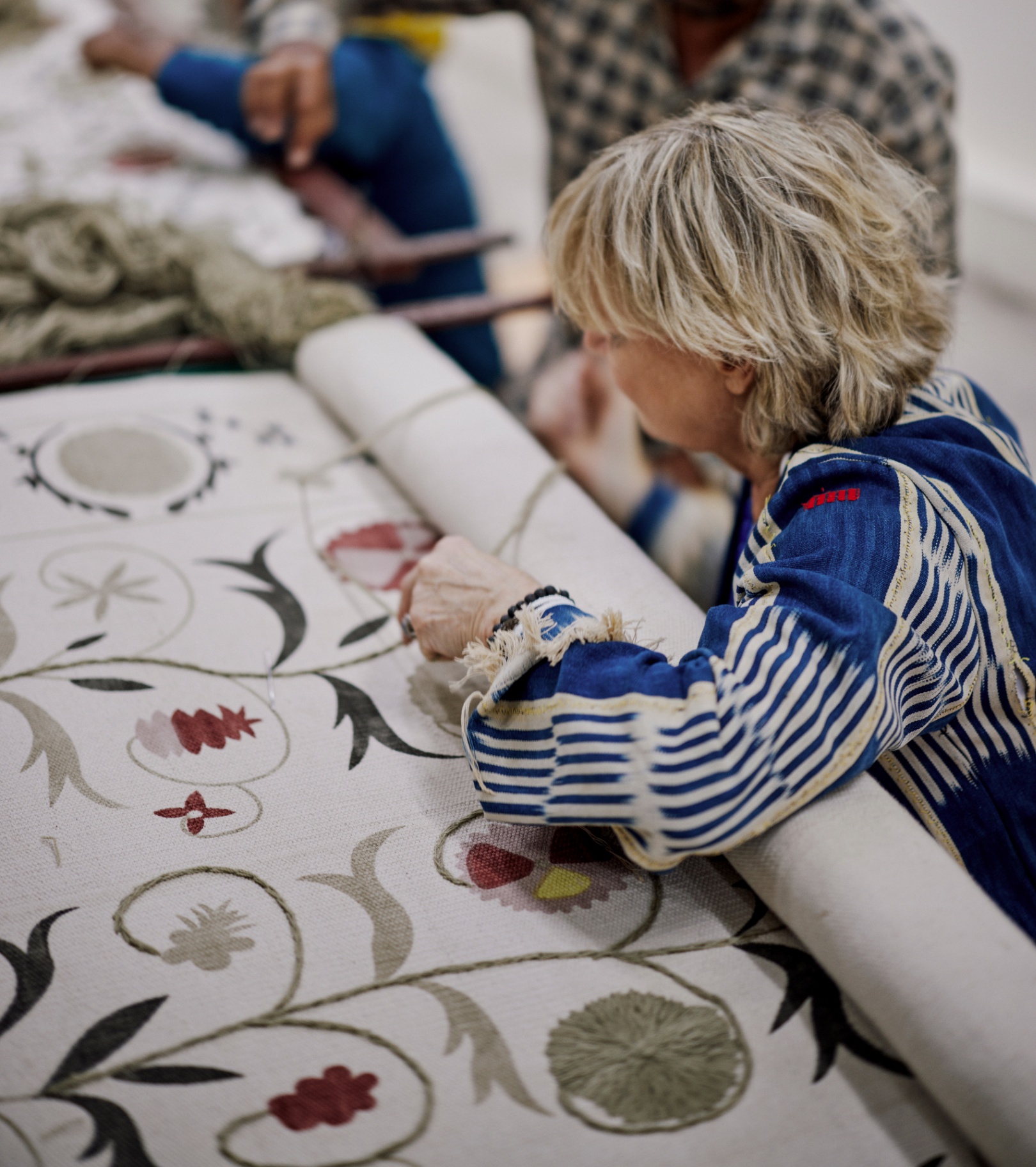 a woman designing a wallpaper print