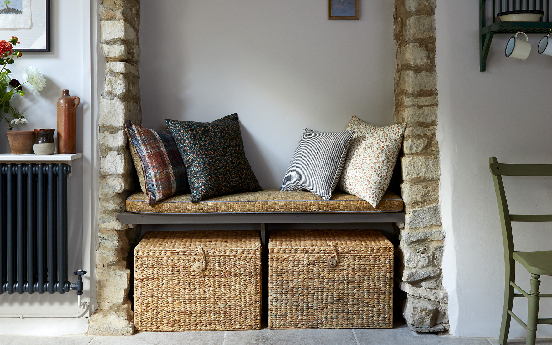 a snug with bench and wicker baskets