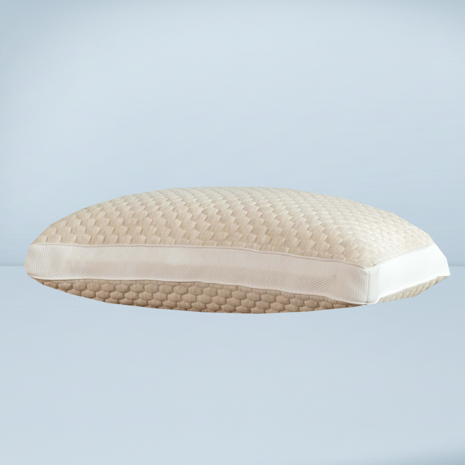 an off white textured Shredded Memory Foam Standard Pillow from soak and sleep on a blue background