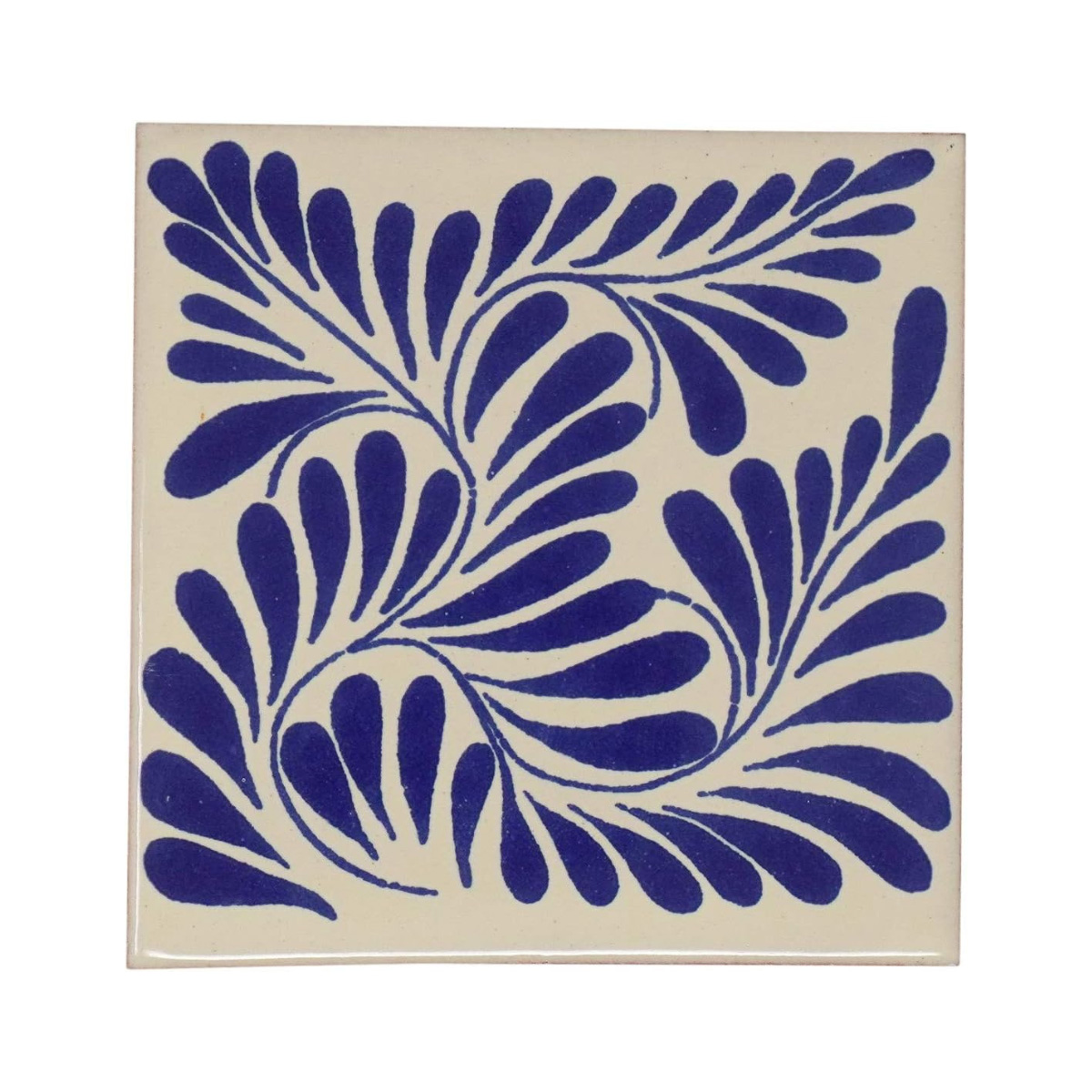 a white tile with bright blue leaf pattern on a white background