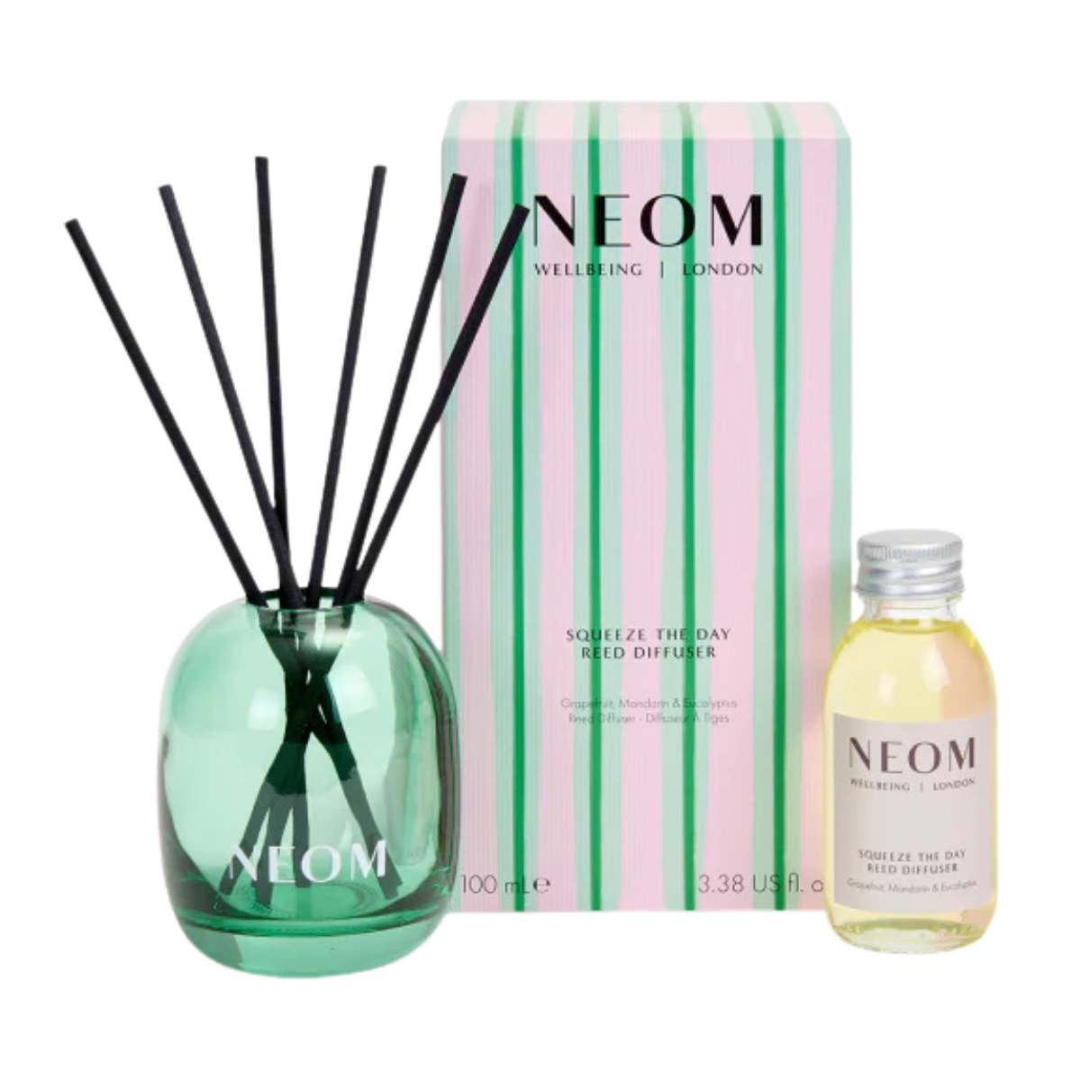 a green glass reed diffuser with a pink and green stripe box