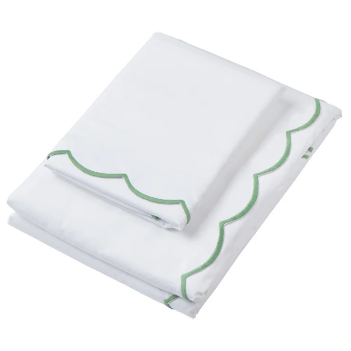 a folded white duvet cover with a green scalloped trim