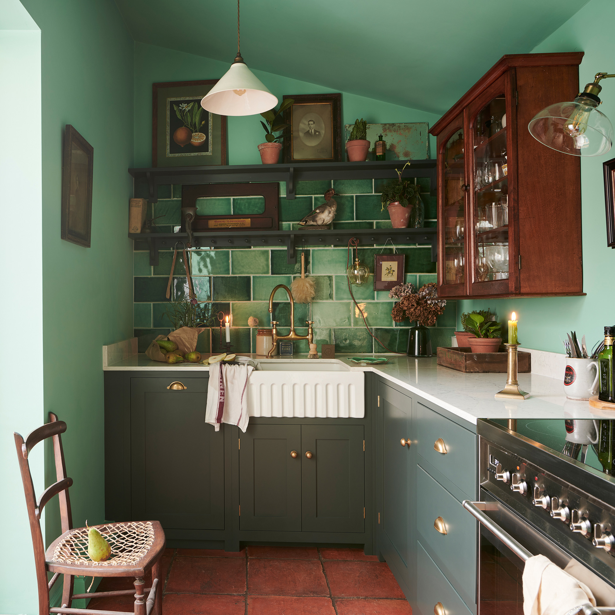 a green kitchen with green tiles