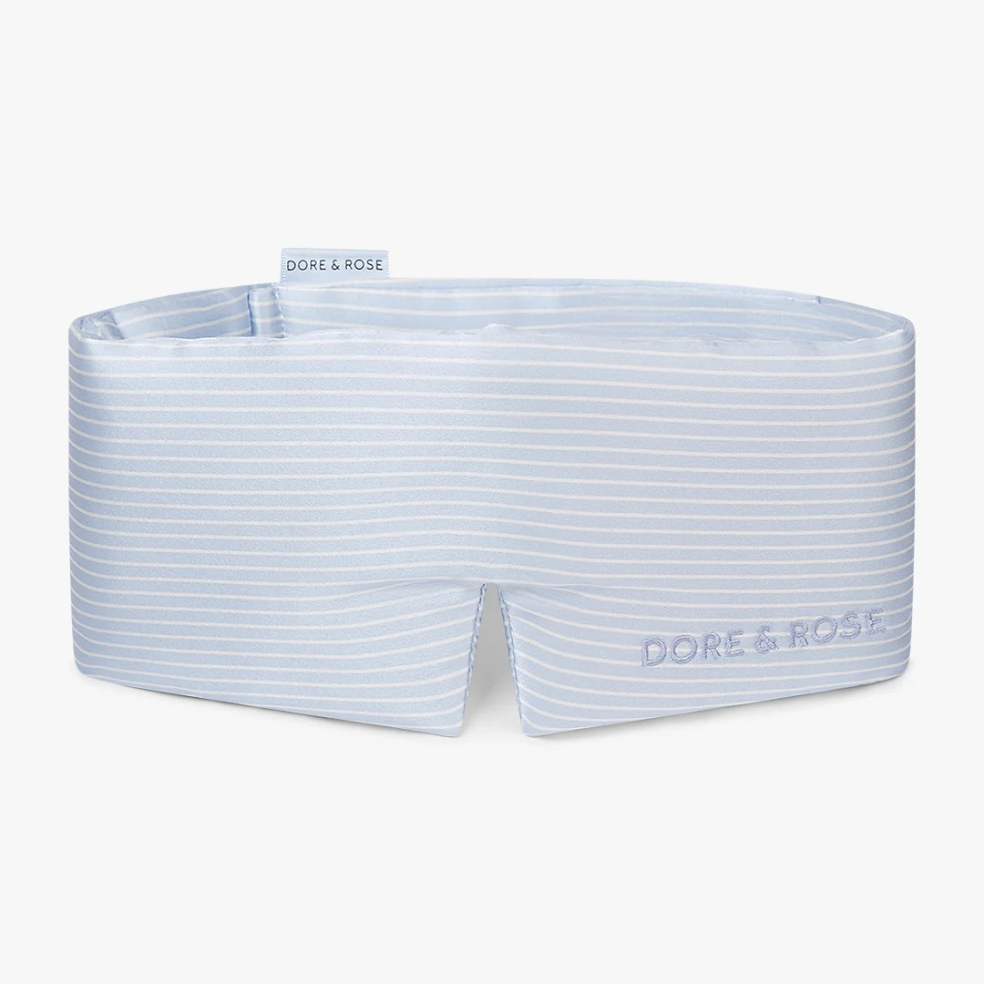 dore and rose mulberry silk Deep Sleep Mask pictured in blue stripe on a white background