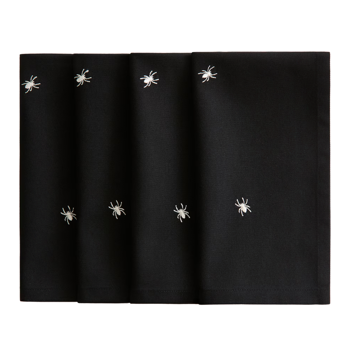 black napkins with white spider embroidery