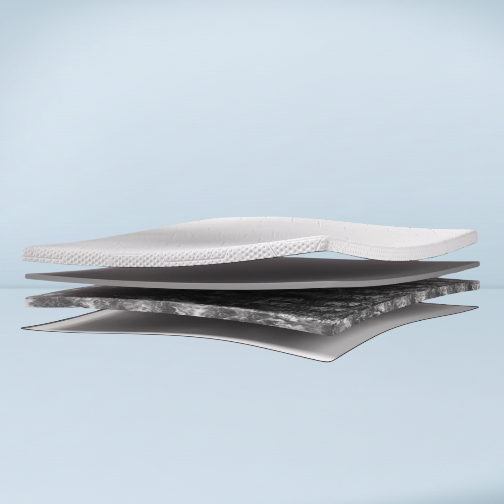 a mattress topper opened up to see multiple foam layers