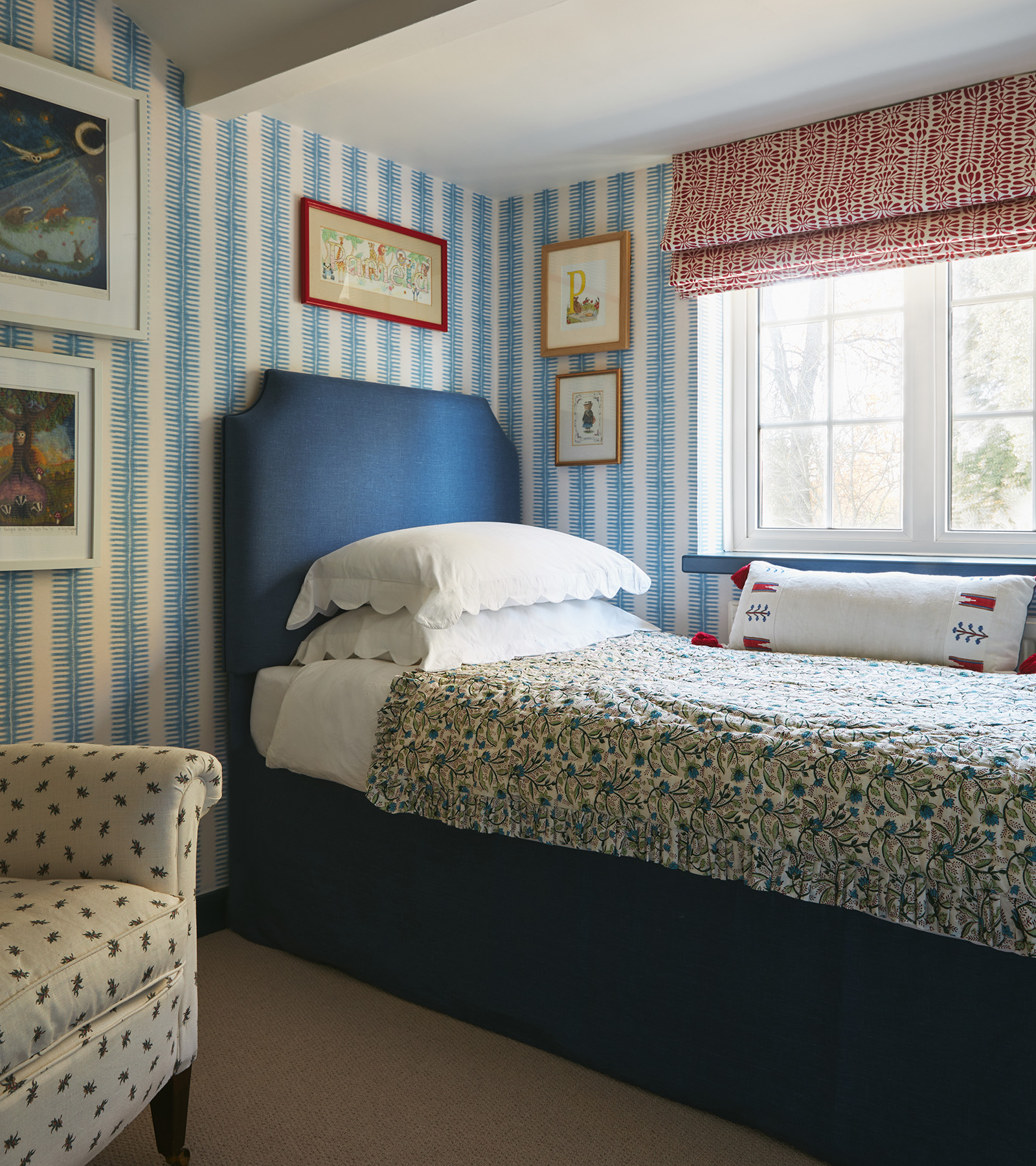 a blue bedroom with a single bed