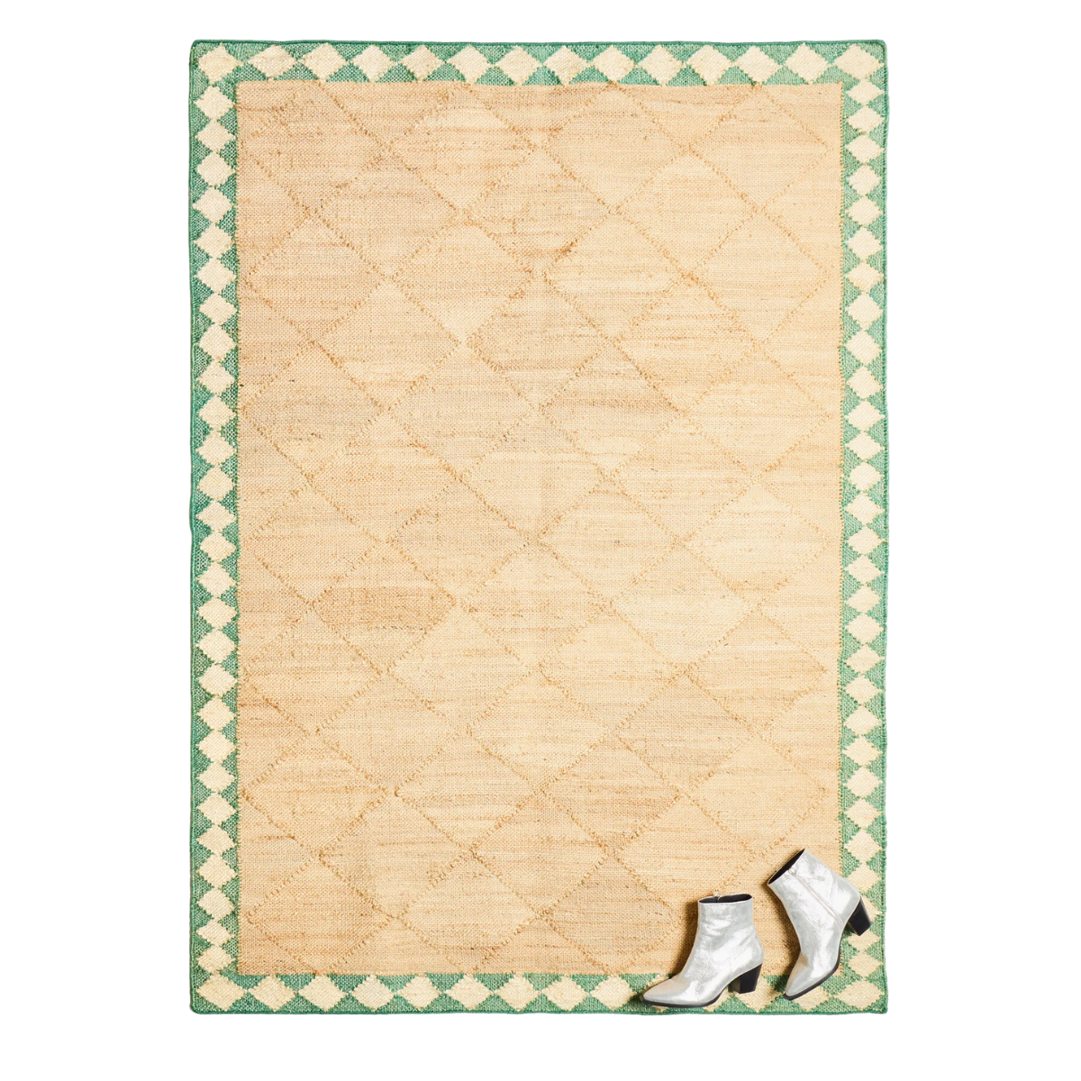 a jute rug with a green diamond border