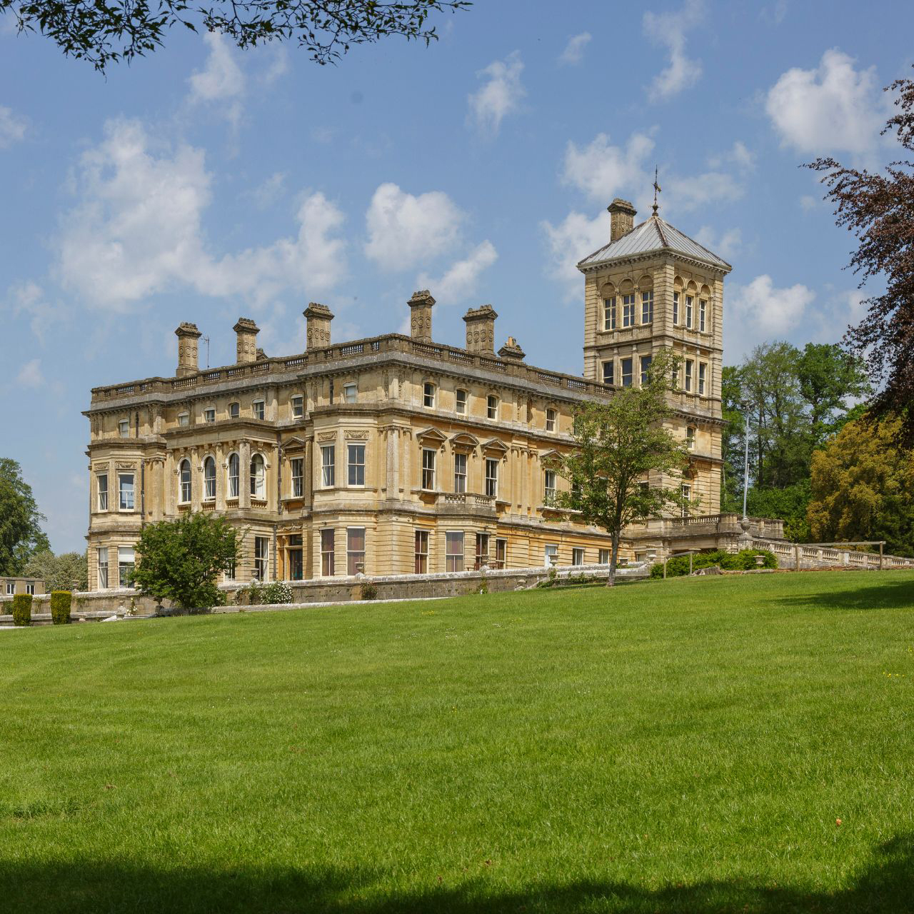 Rendcomb Park, Gloucestershire primary mansion pictured looking grand on a hill