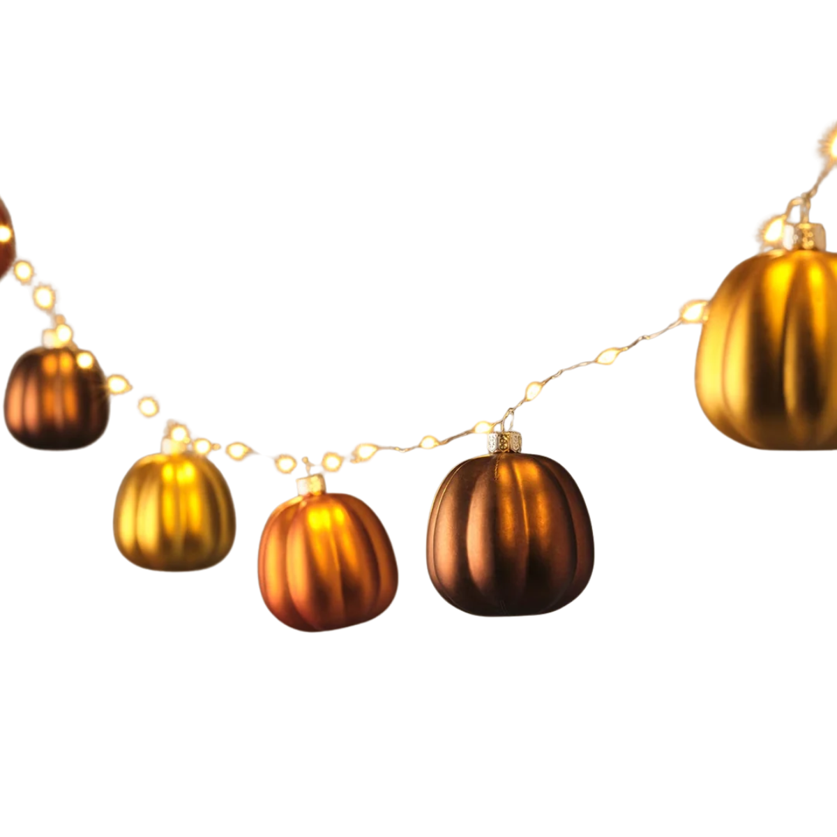 a string of metallic orange pumpkin decorations on a string of fairy lights