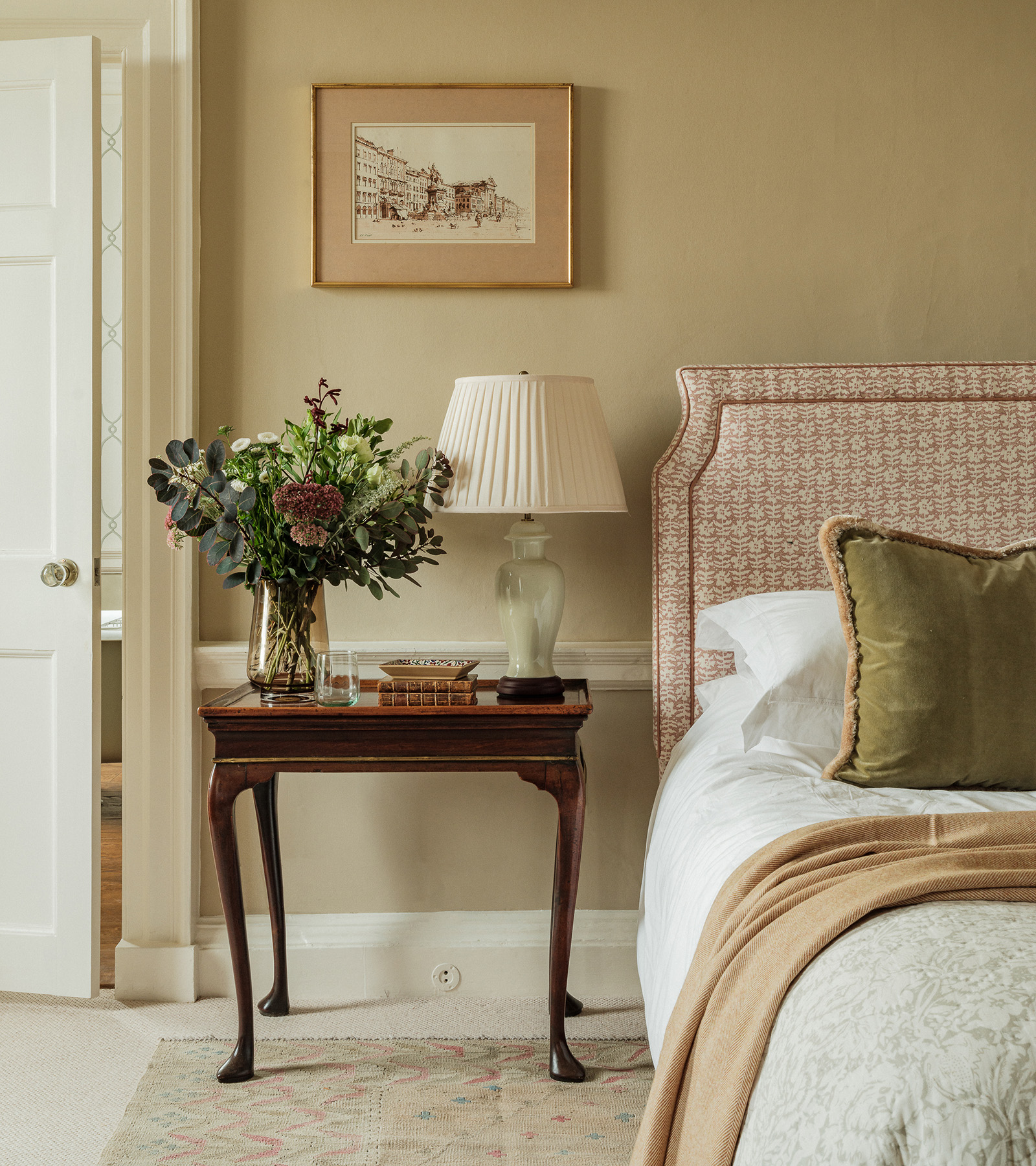 aboise bedroom with antique table