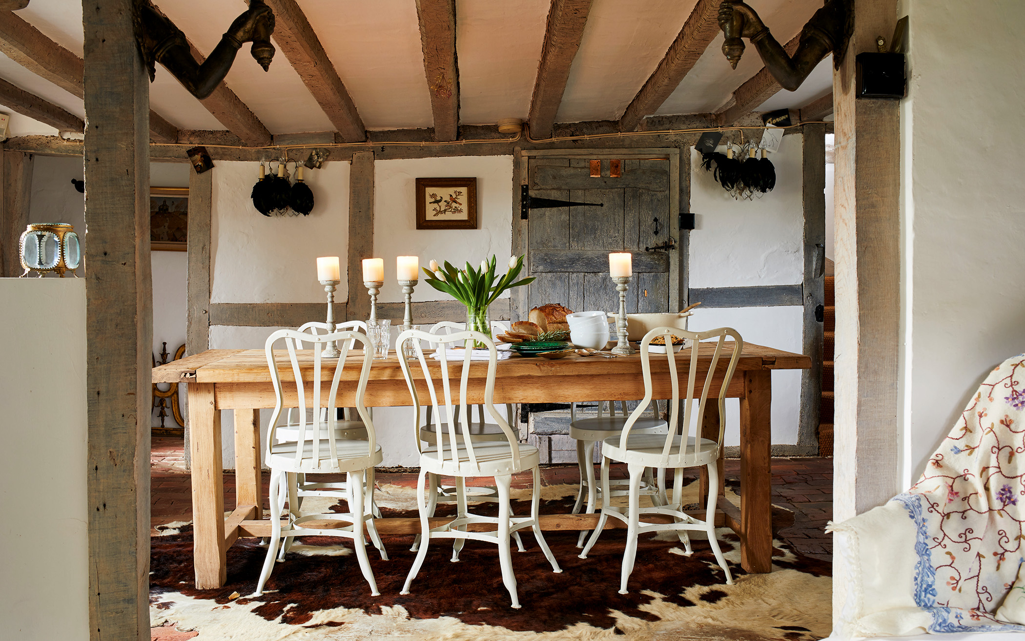 a farmhouse dining room with a wooden table