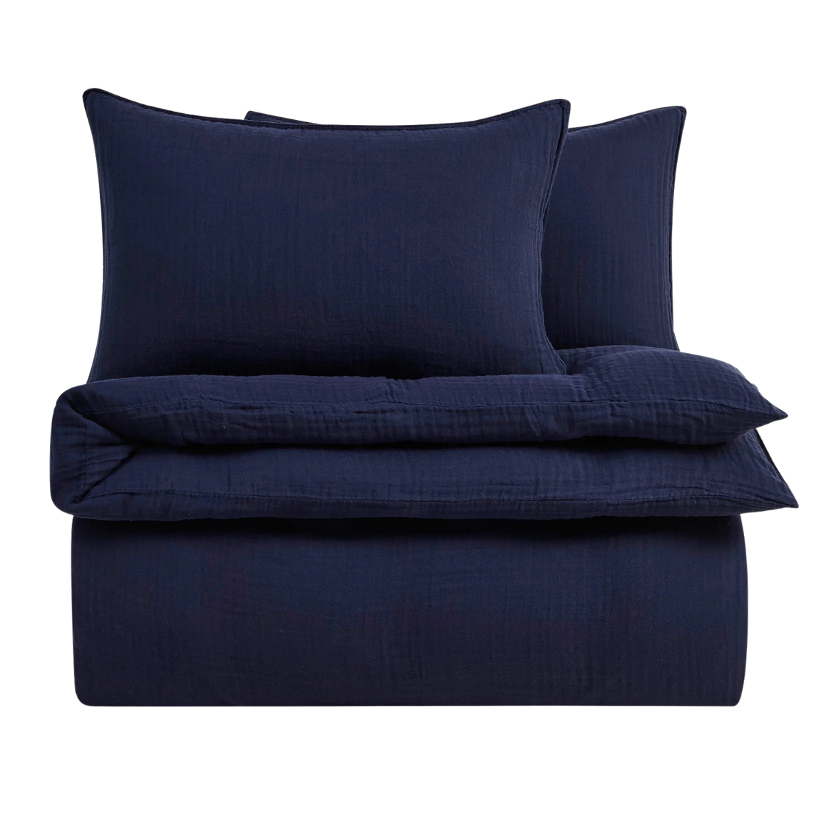a navy blue duvet cover set folded up on a white background
