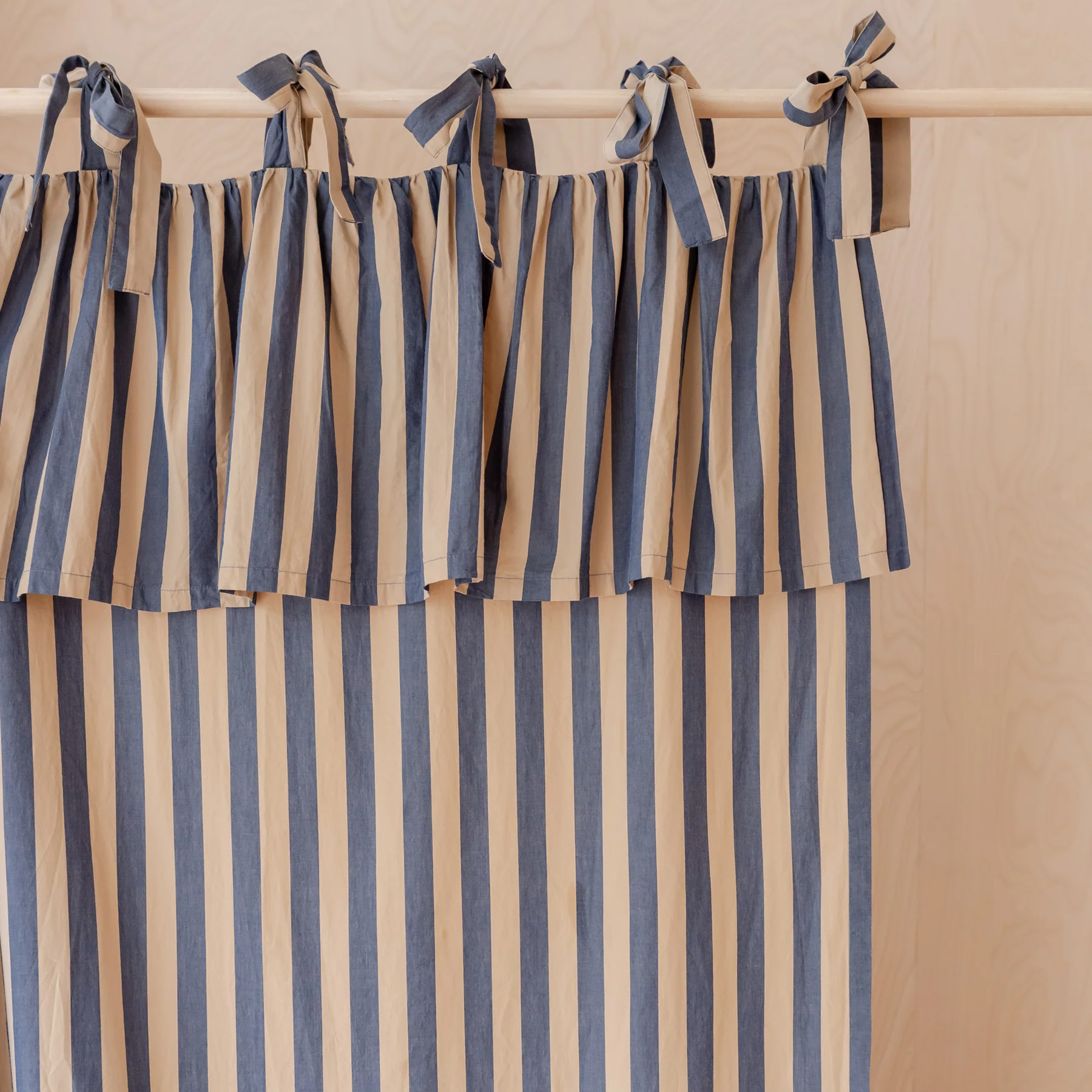 blue and white stripe tie top curtains with a ruffle at the top