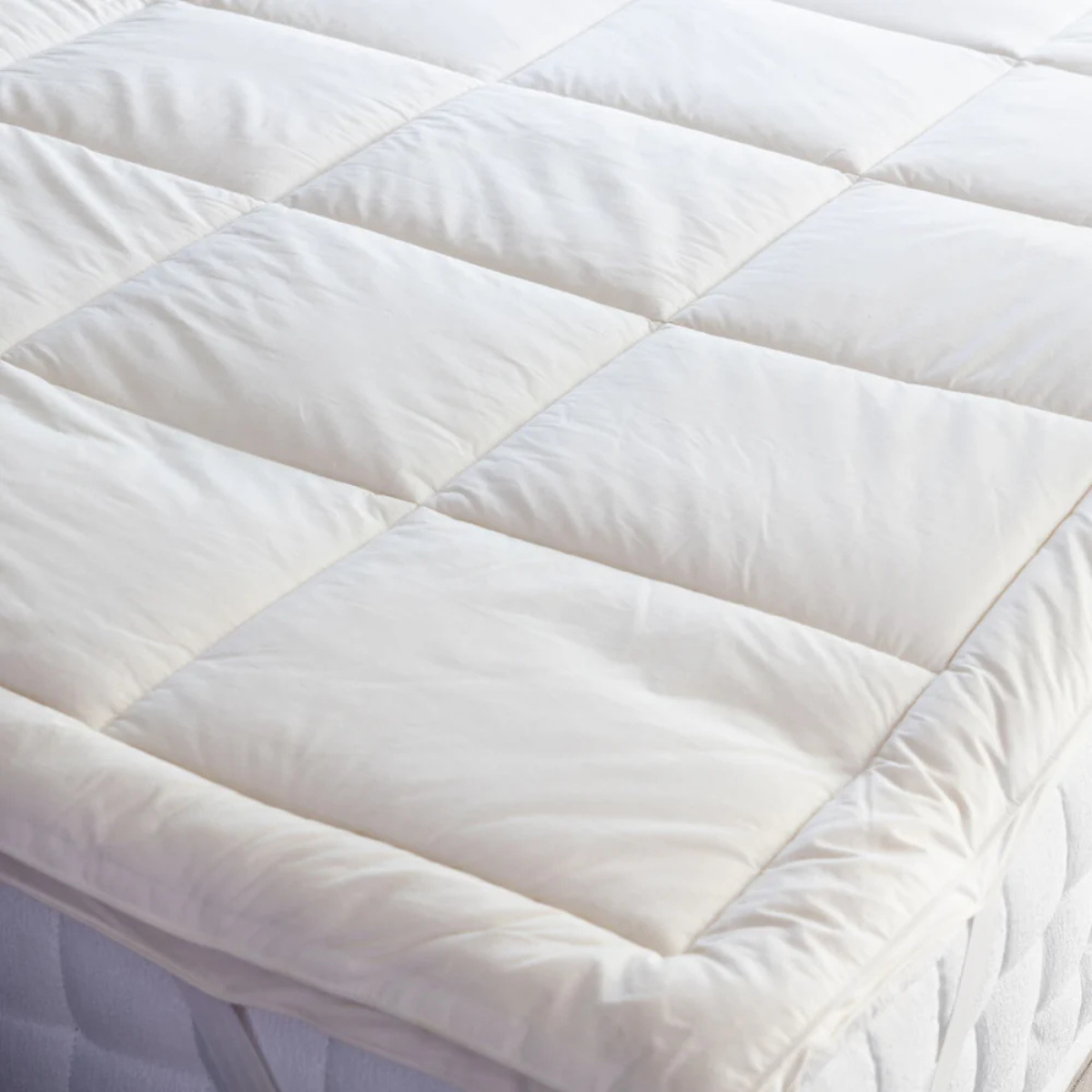 a close up of a mattress topper