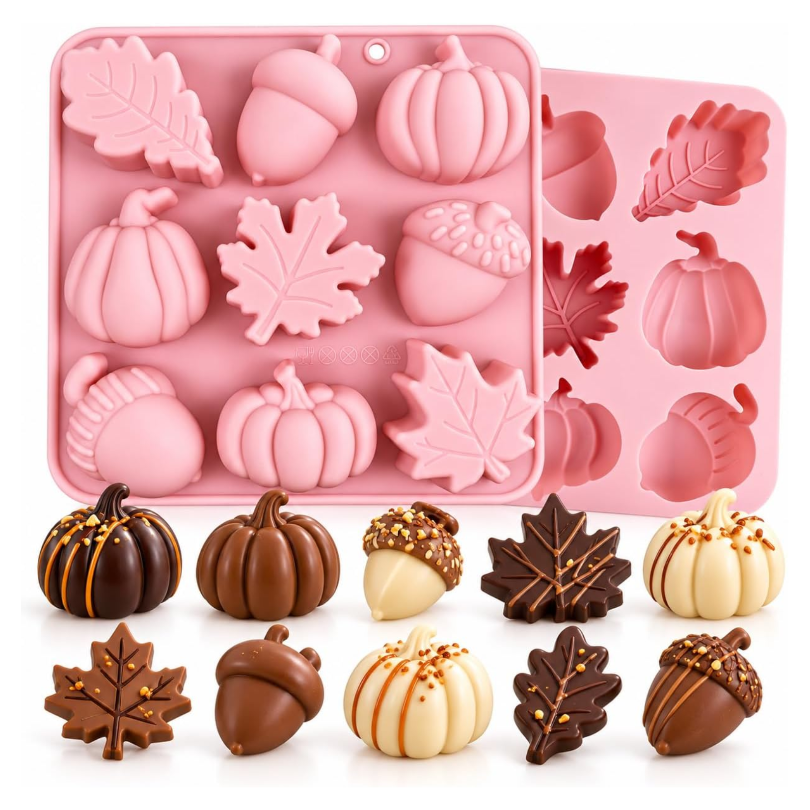 Pink silicone baking mold with autumn-themed cavities shaped like pumpkins, acorns, and leaves, shown alongside finished molded chocolates