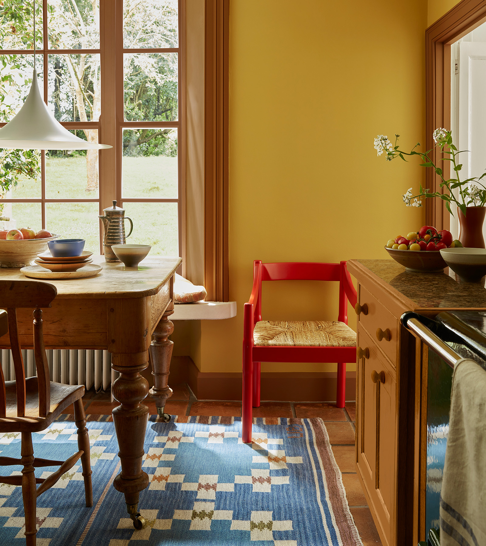 yellow kitchen with a red chair