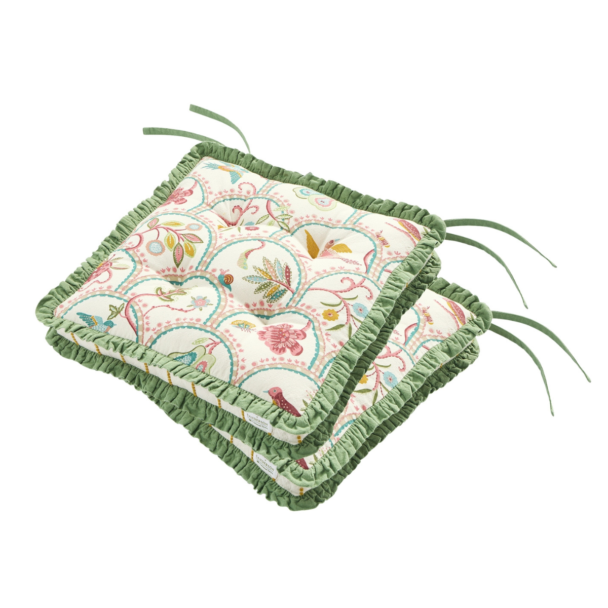 two seat cushions with a white base, multicoloured floral pattern and green ruffed trim