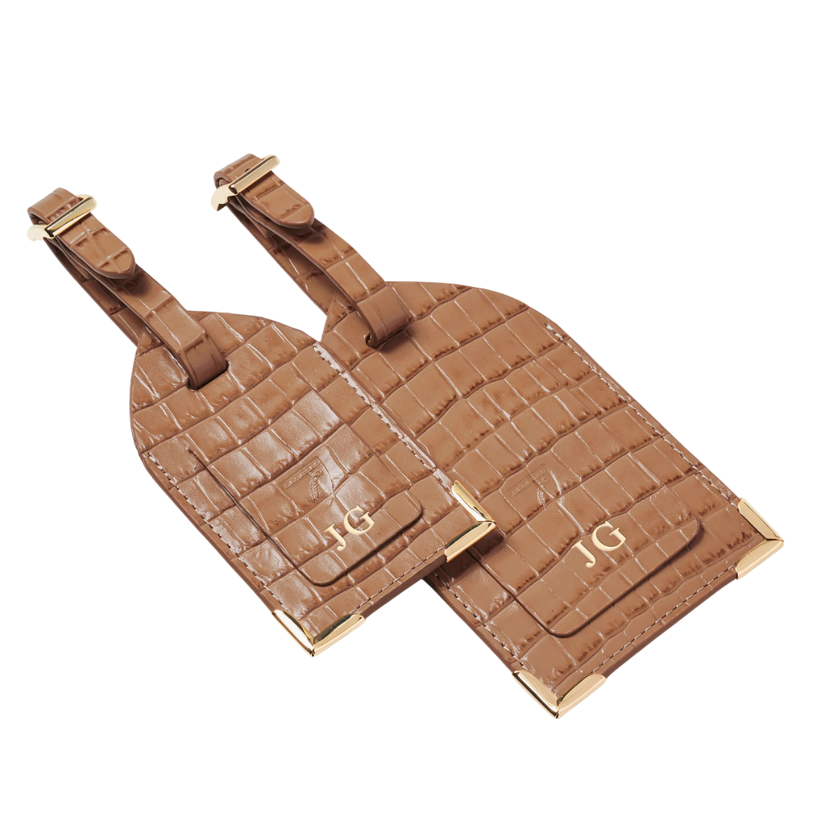 a set of two brown leather luggage tags