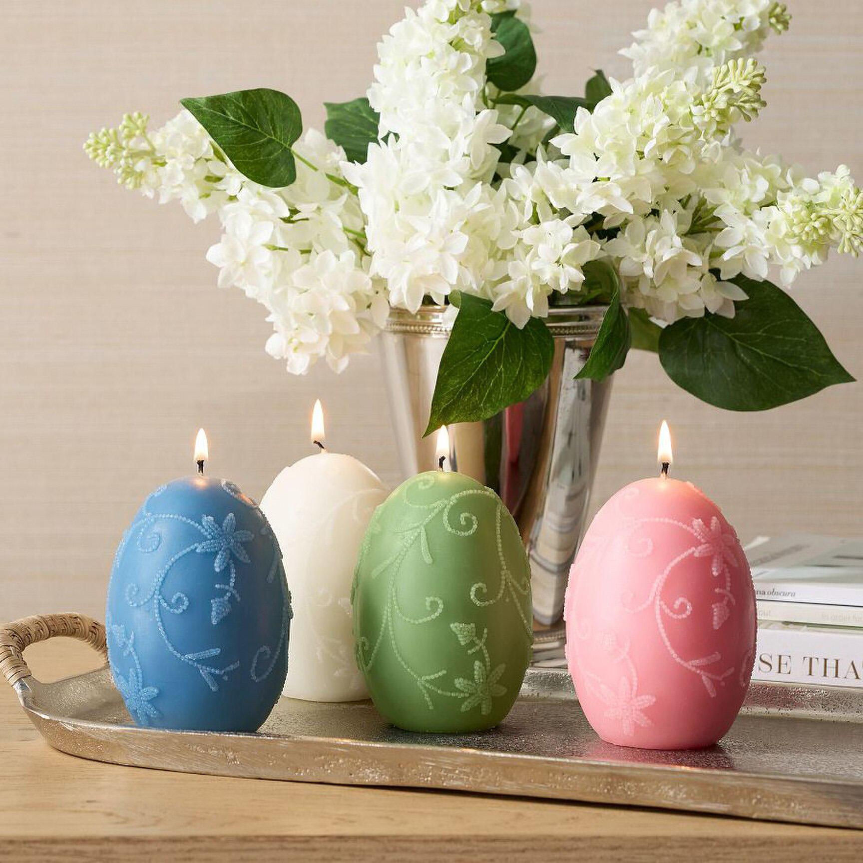 4 wax candles in shape of easter eggs