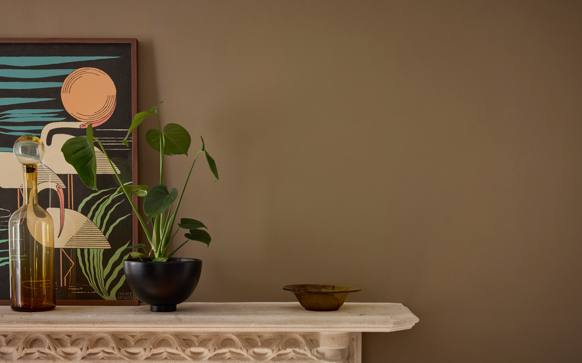 Little Greene’s colour of the year pictured in marle painted on a wall above a mantlepiece