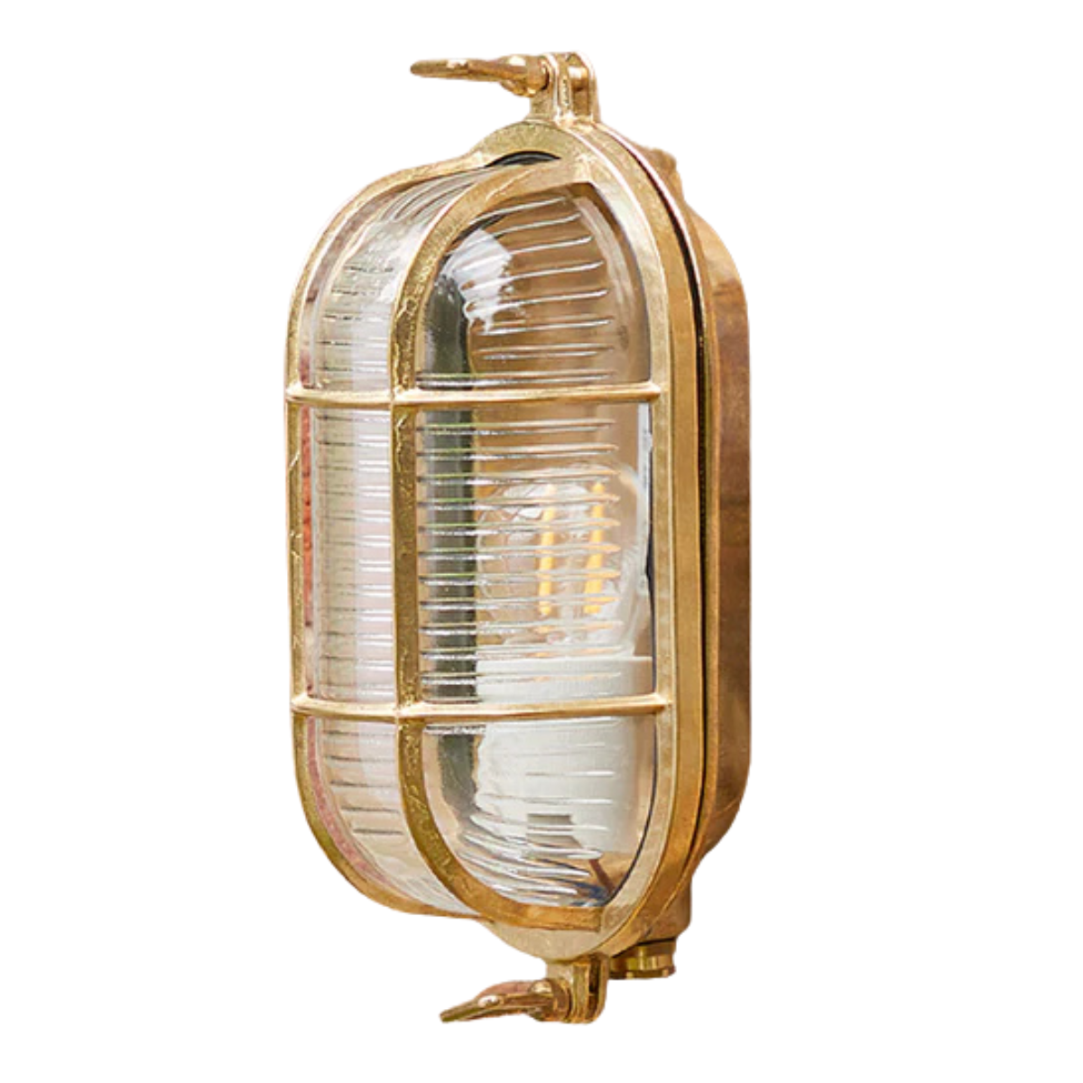 an unlacquered brass wall light with ribbed glass