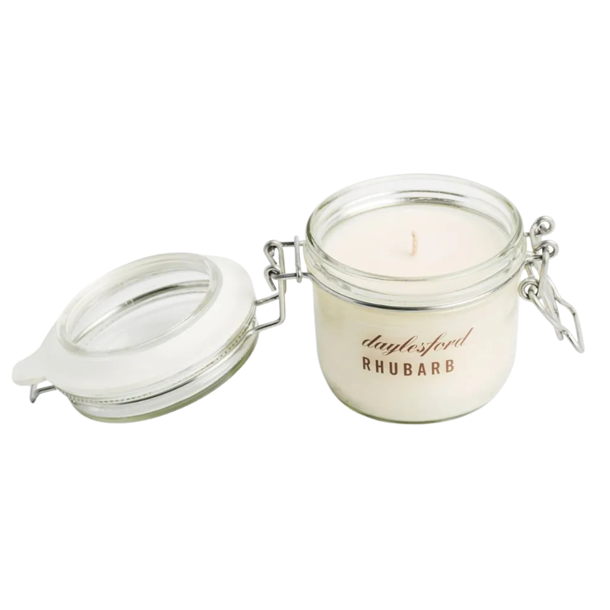 a daylesford rhubarb scented candle in a glass jar with silver hinges