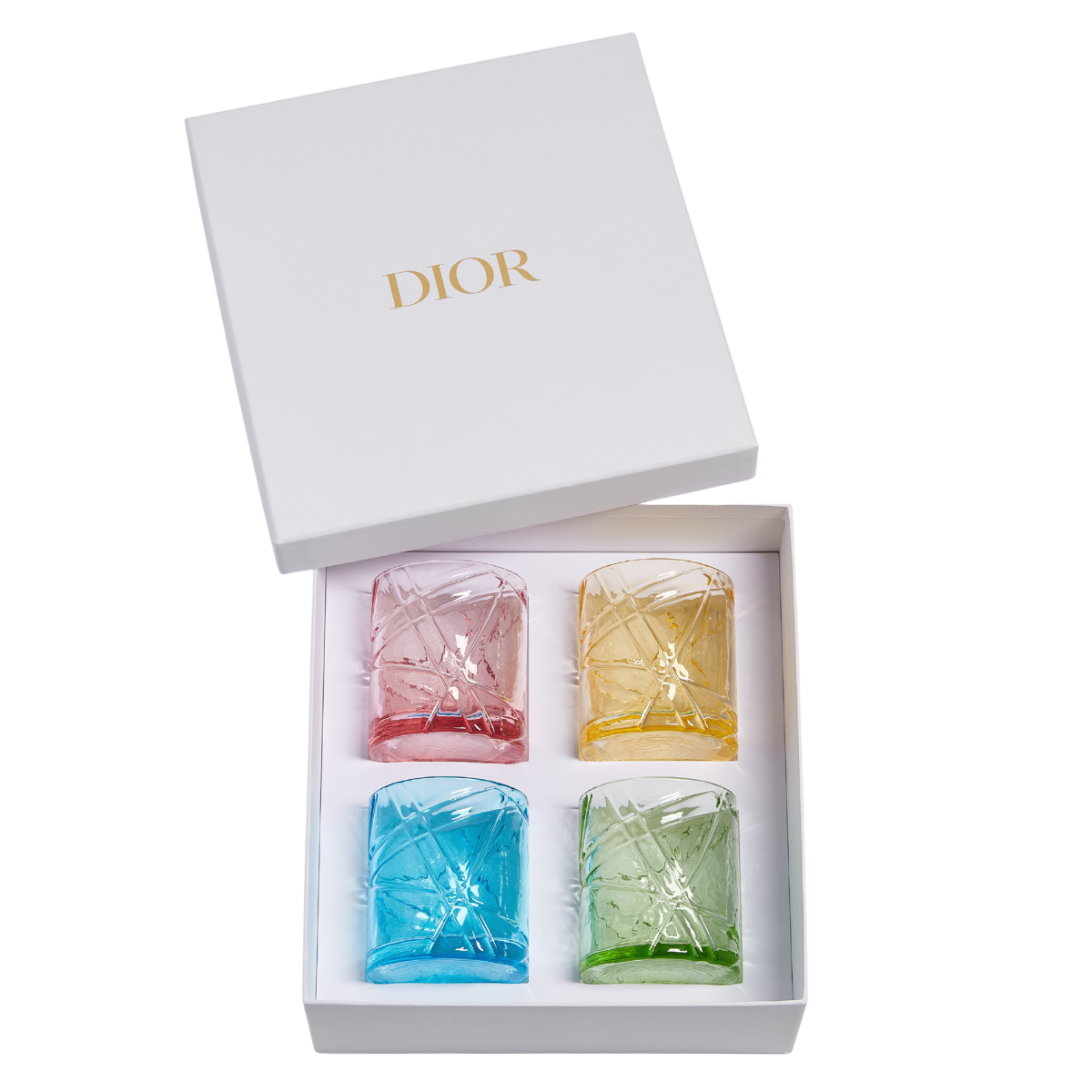 a white dior box with a set of 4 cocktail glasses each in a different bright colour