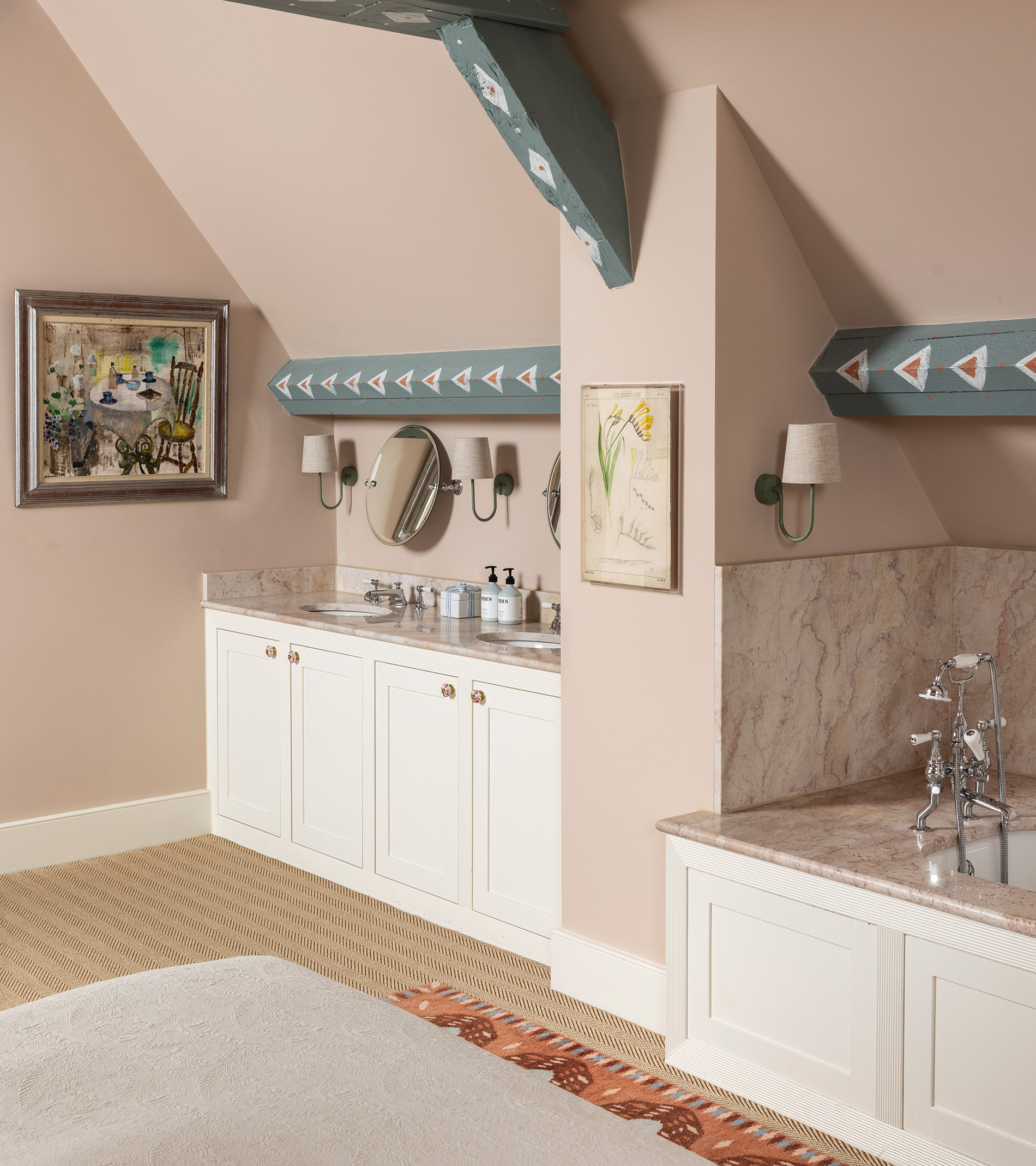a bathroom corner with blue painted wooden beams, white and grey marble tops and splashback above white built in cupboards and plaster pink walls