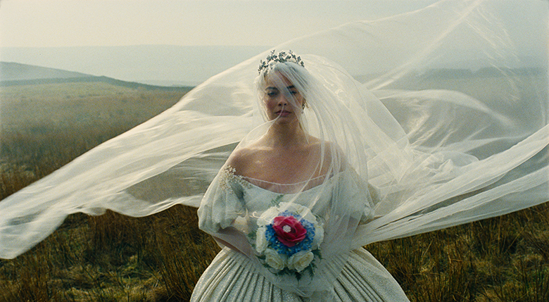 Margot Robbie as Cathy in a wedding dress in Wuthering Heights