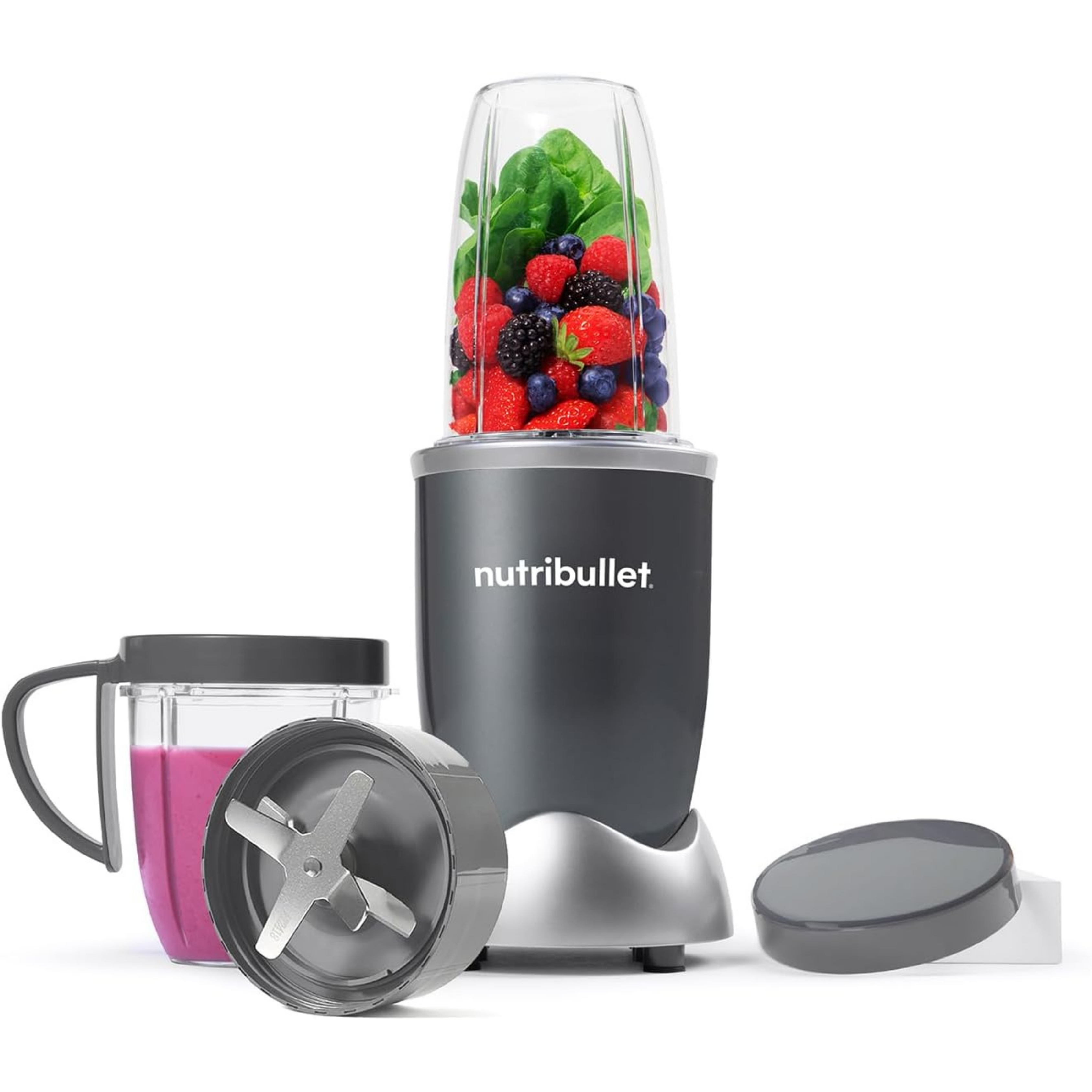 nutribullet Blender 600 Series in Graphite pictured with smoothie fruit inside and parts on a white background