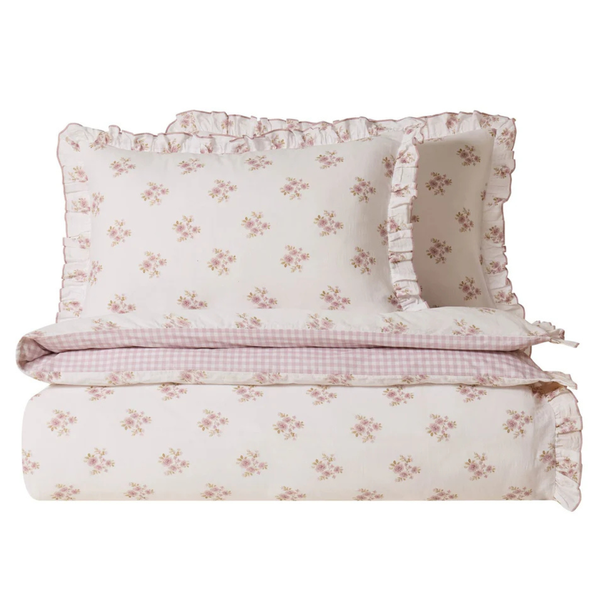 a duvet and two pillows in a cream and pale pink ditsy floral print with a gingham reverse print