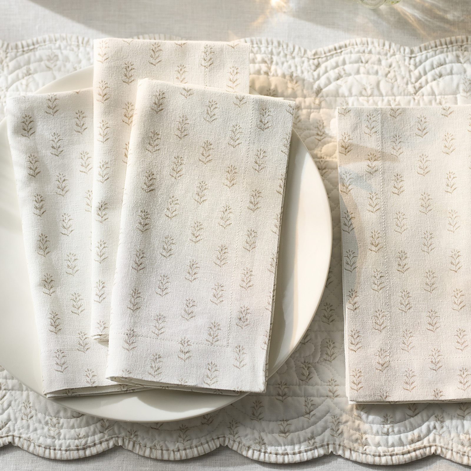 white napkins with leaf pattern