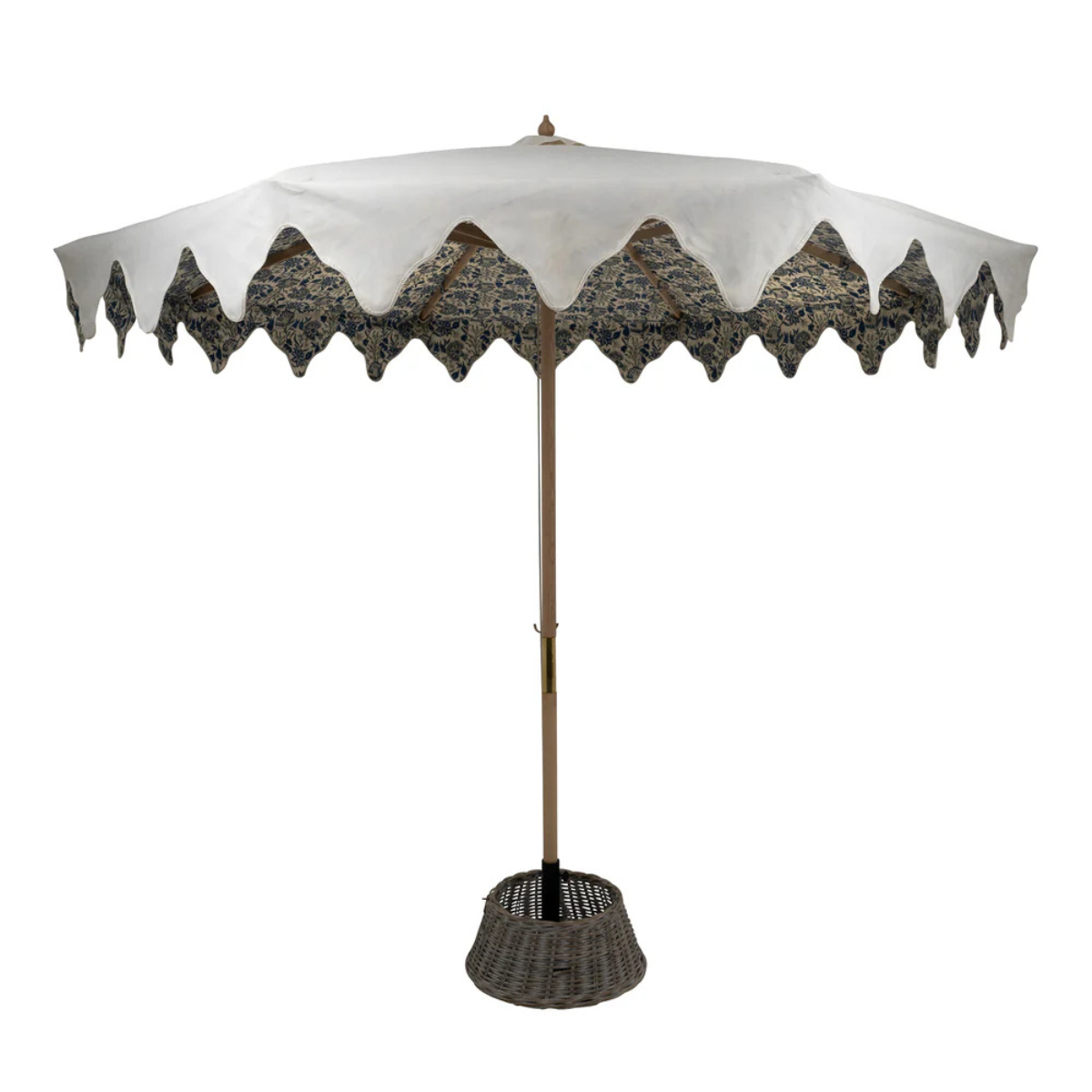 a luxury white parasol with a patterned canopy and scalloped rim and a wicker base