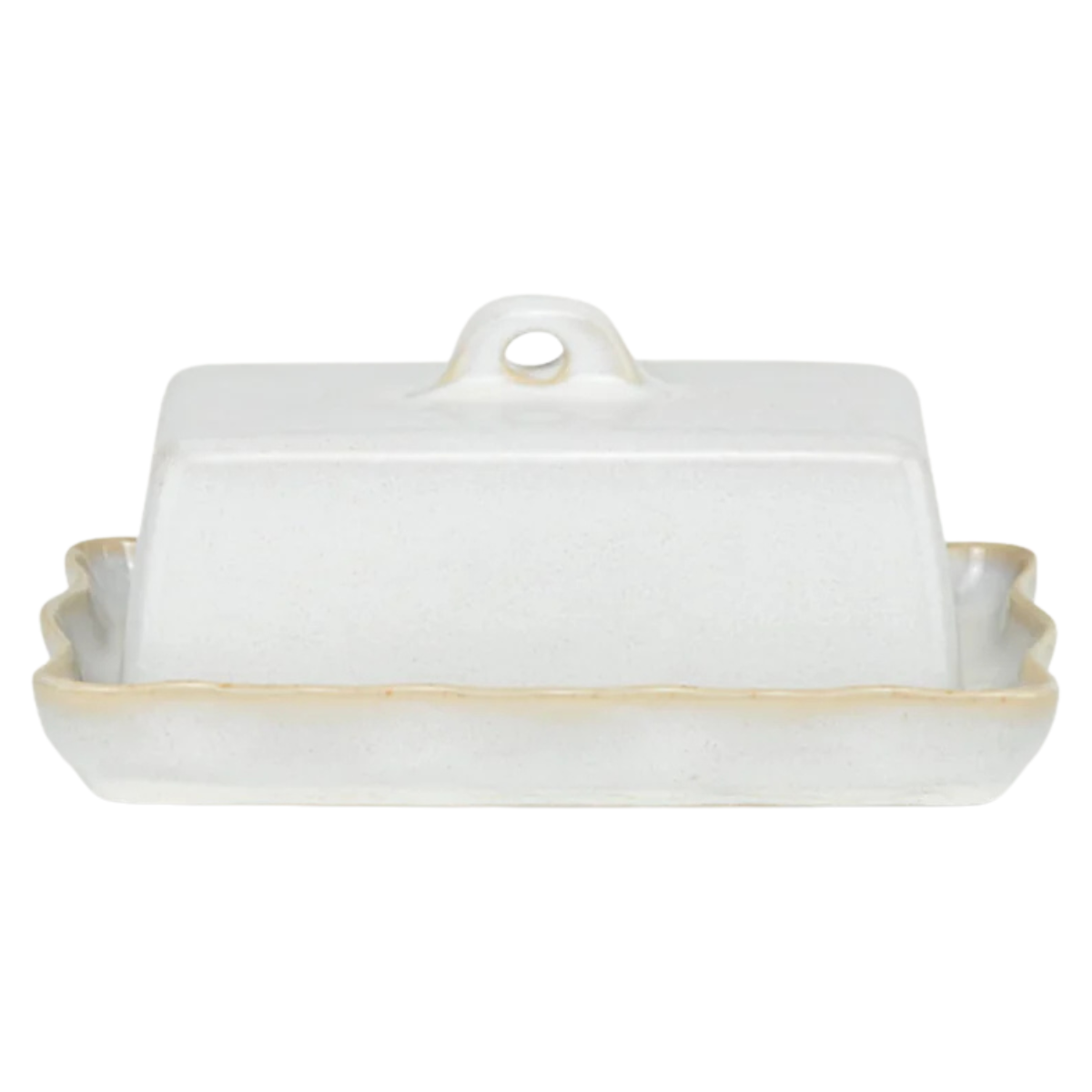 a cream stoneware butter dish with a wavy edge