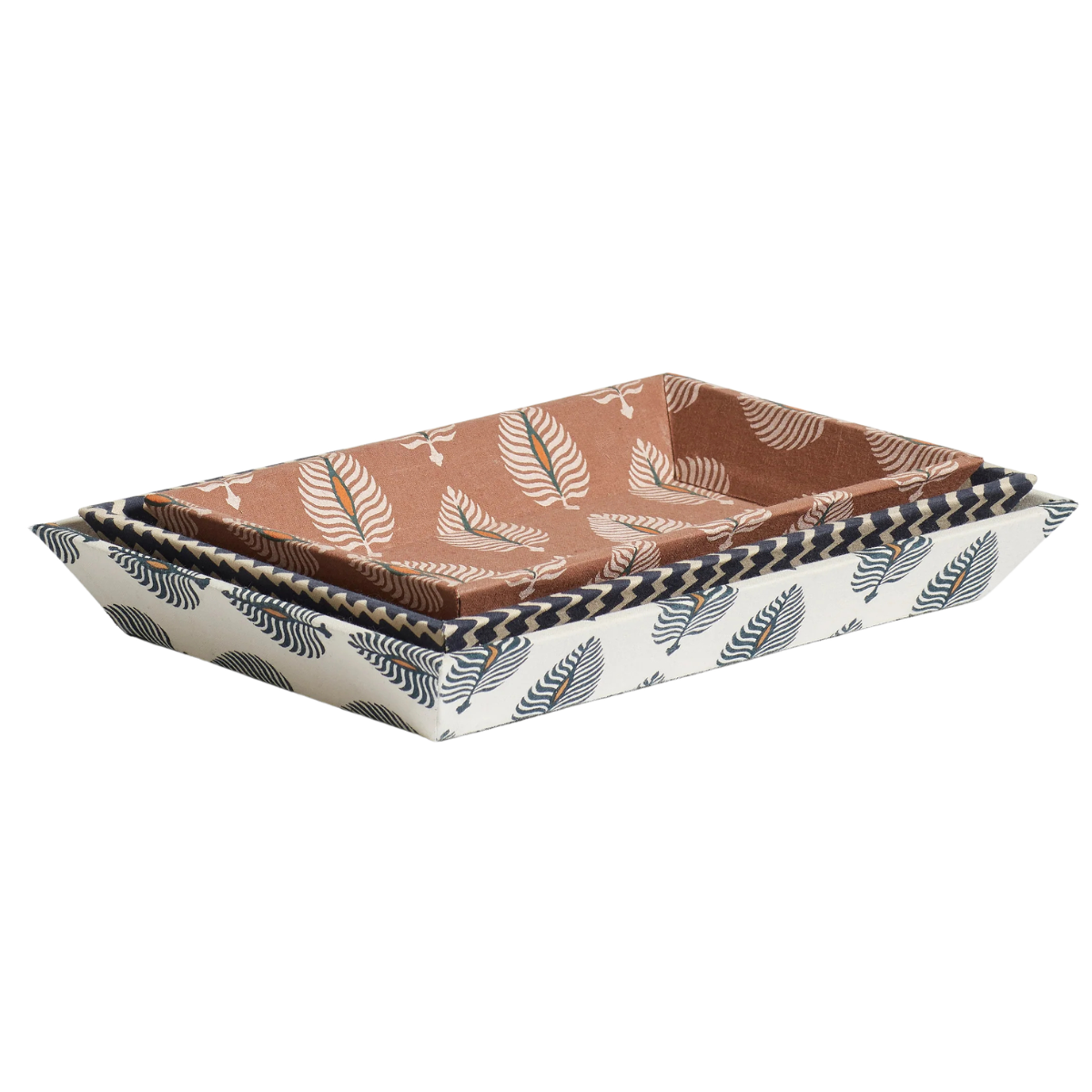 a set of three fabric trays in different earthy feather patterns stacked on top of eachother