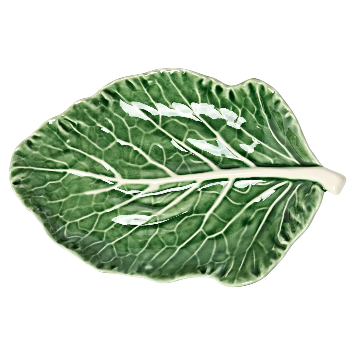 a green serving platter in the shape of a cabbage leaf