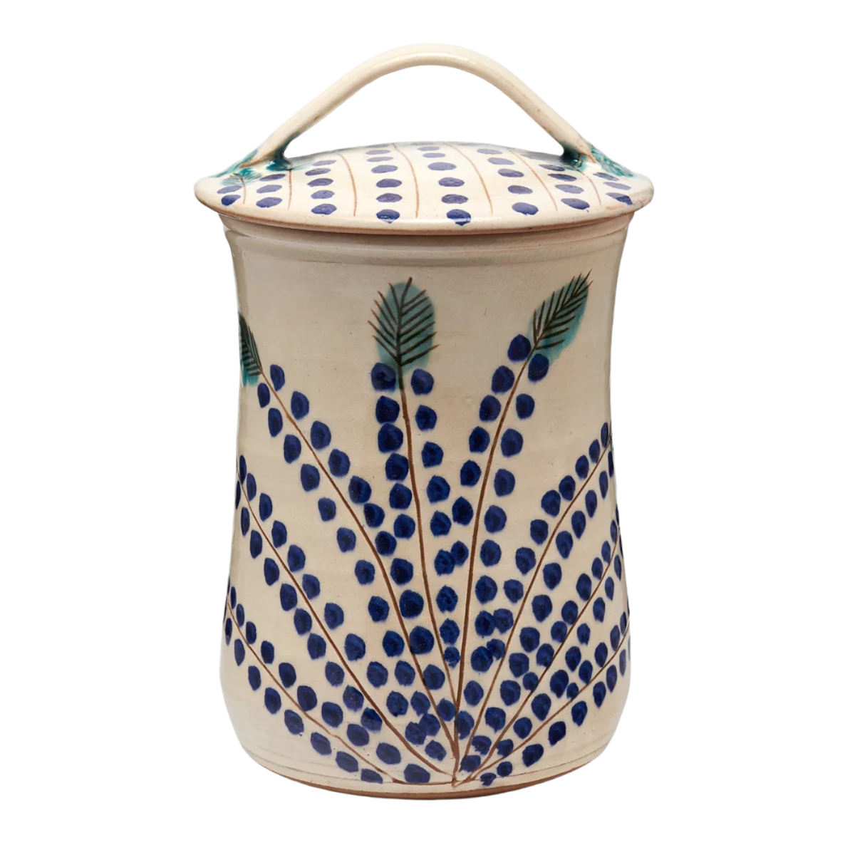 a cream and blue polka dot ceramic canister with lid