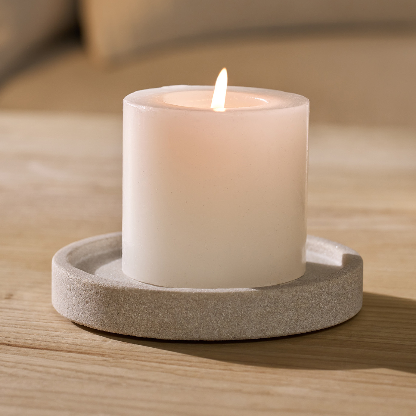a grey candle plate