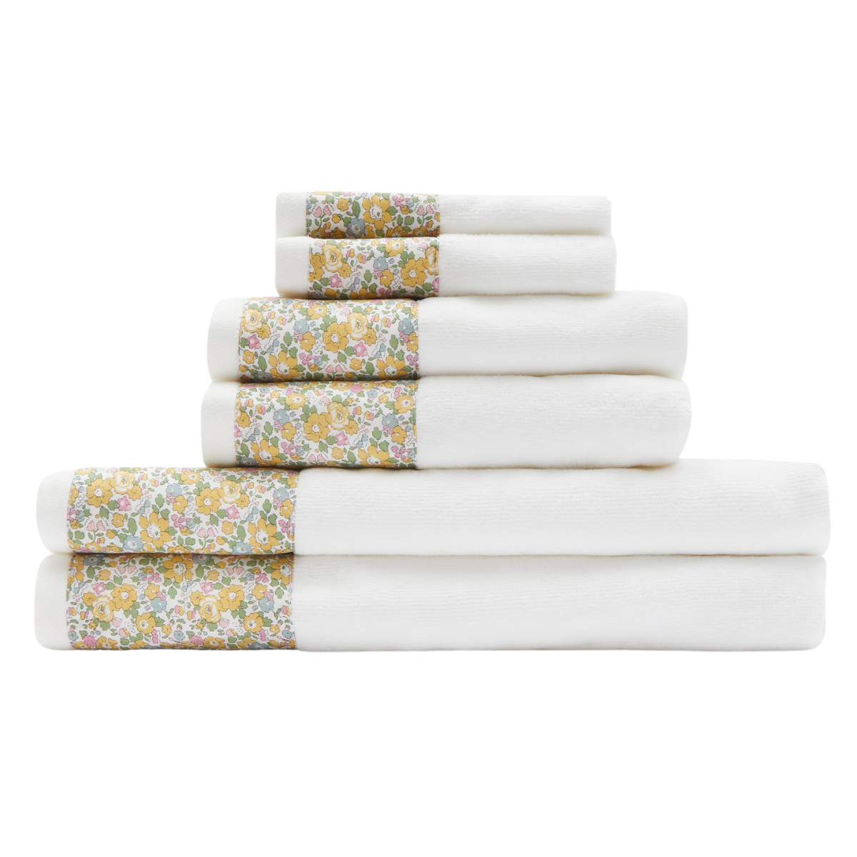 a pile of white towels with a strip of yellow florals