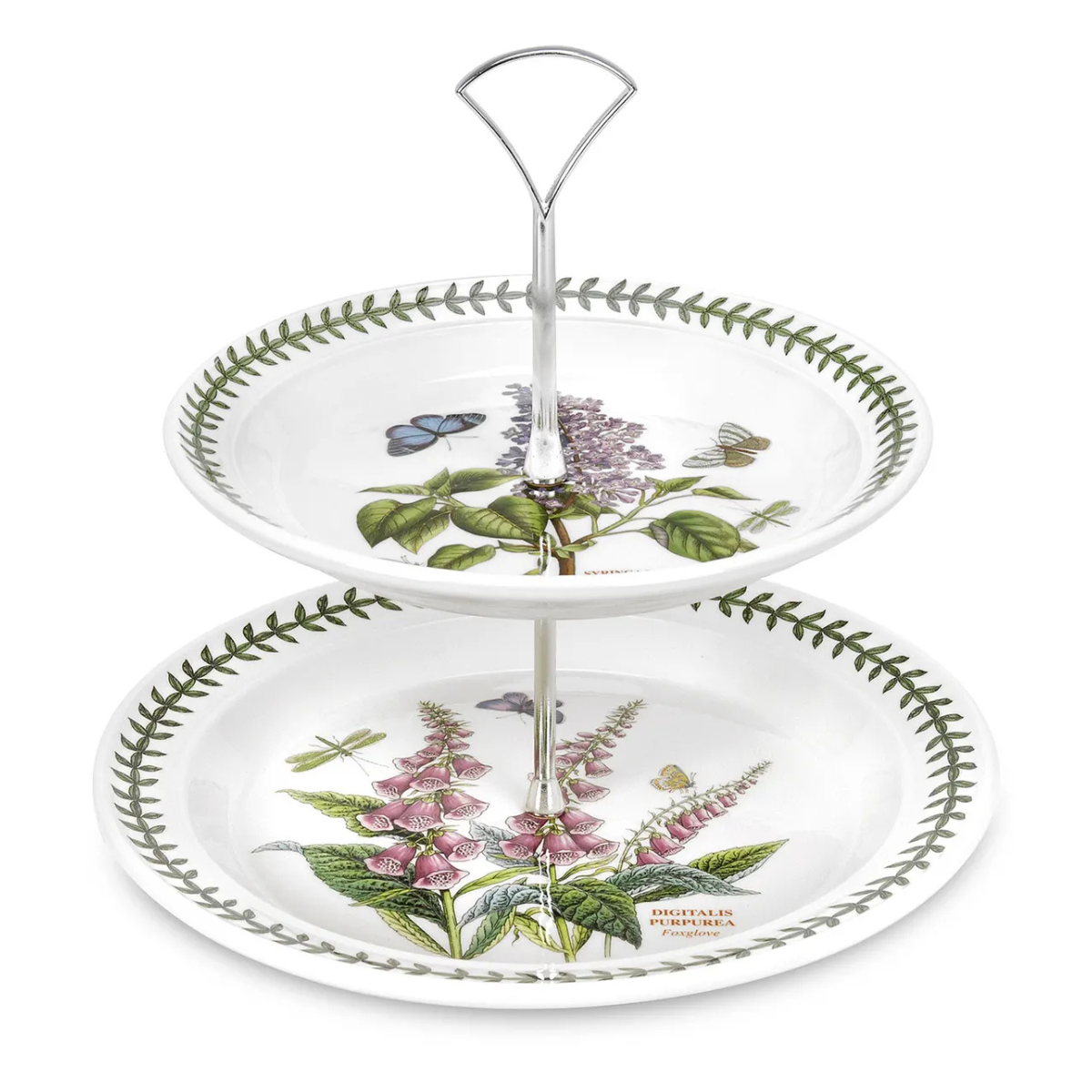 a white two tiered cake stand with traditional floral illustrations