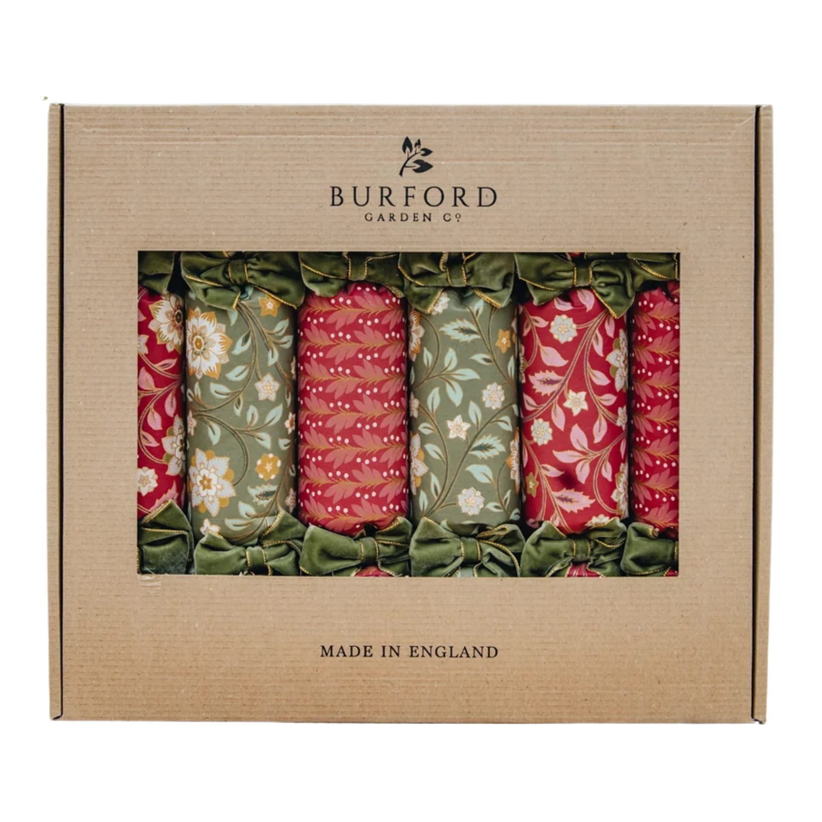 Boxed set of six Burford Garden Co. Christmas crackers presented in kraft packaging. Wrapped in botanical floral and leaf patterns in rich crimson red and sage green, tied with plush olive-green velvet bows