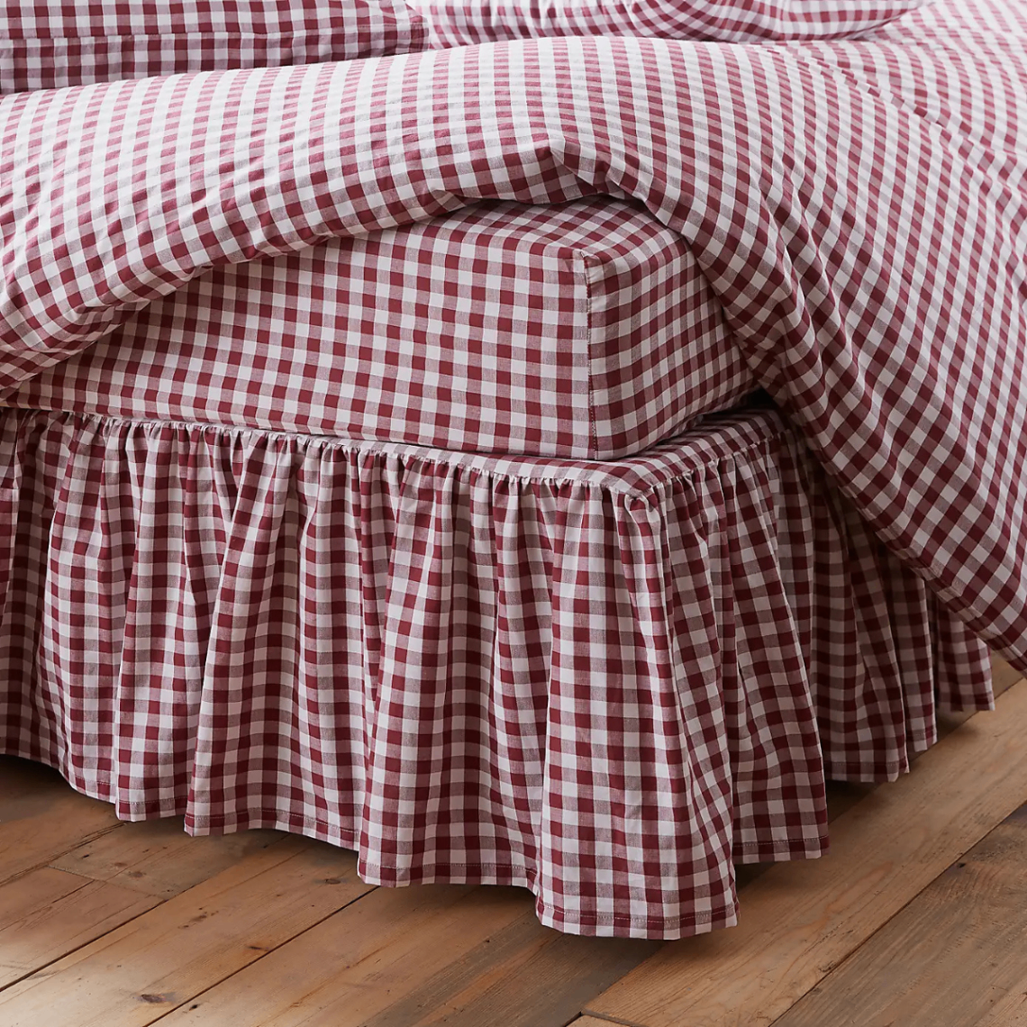 a red and white cotton bed valance