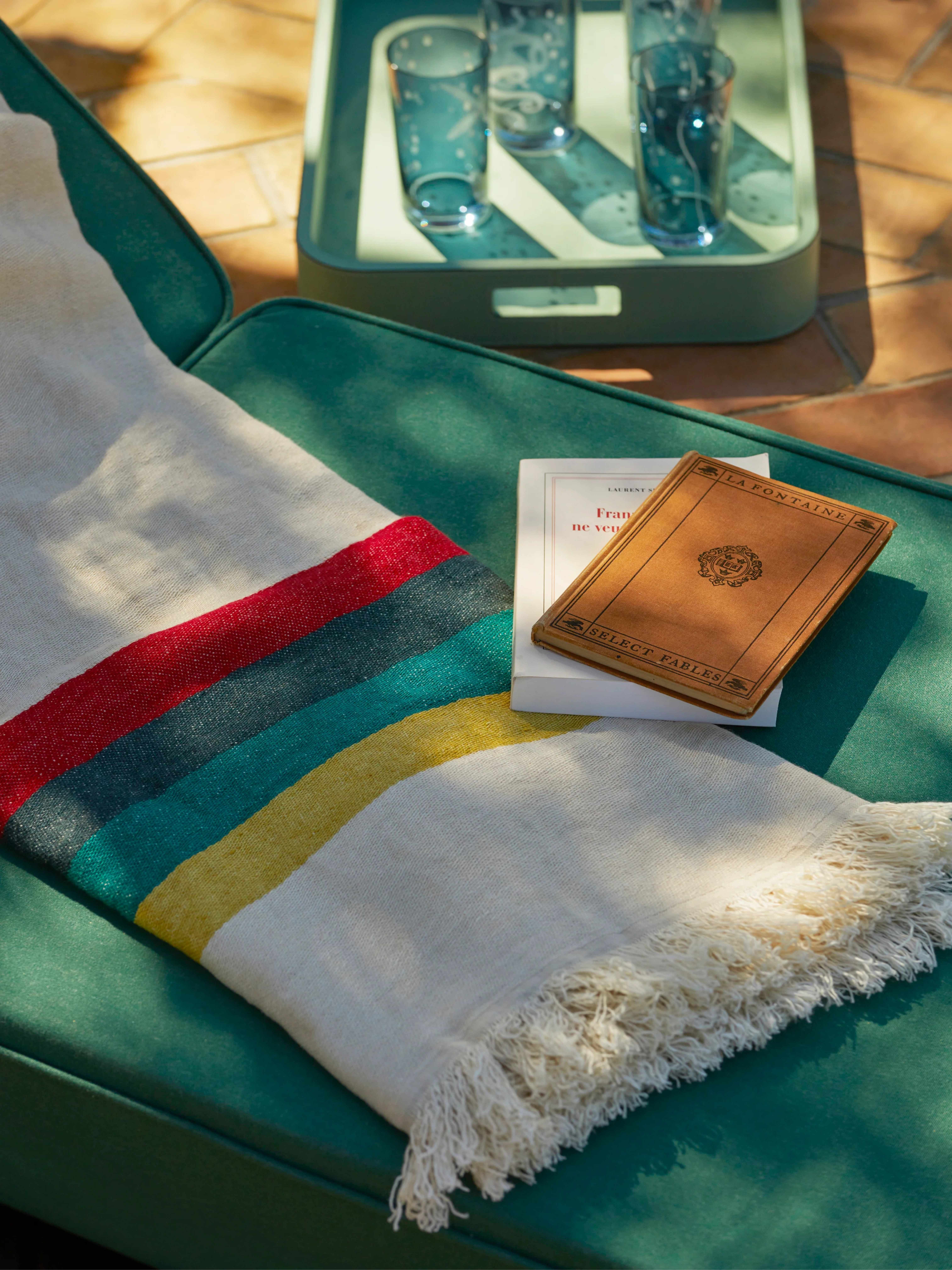linen beach towel pictured on a sun lounger