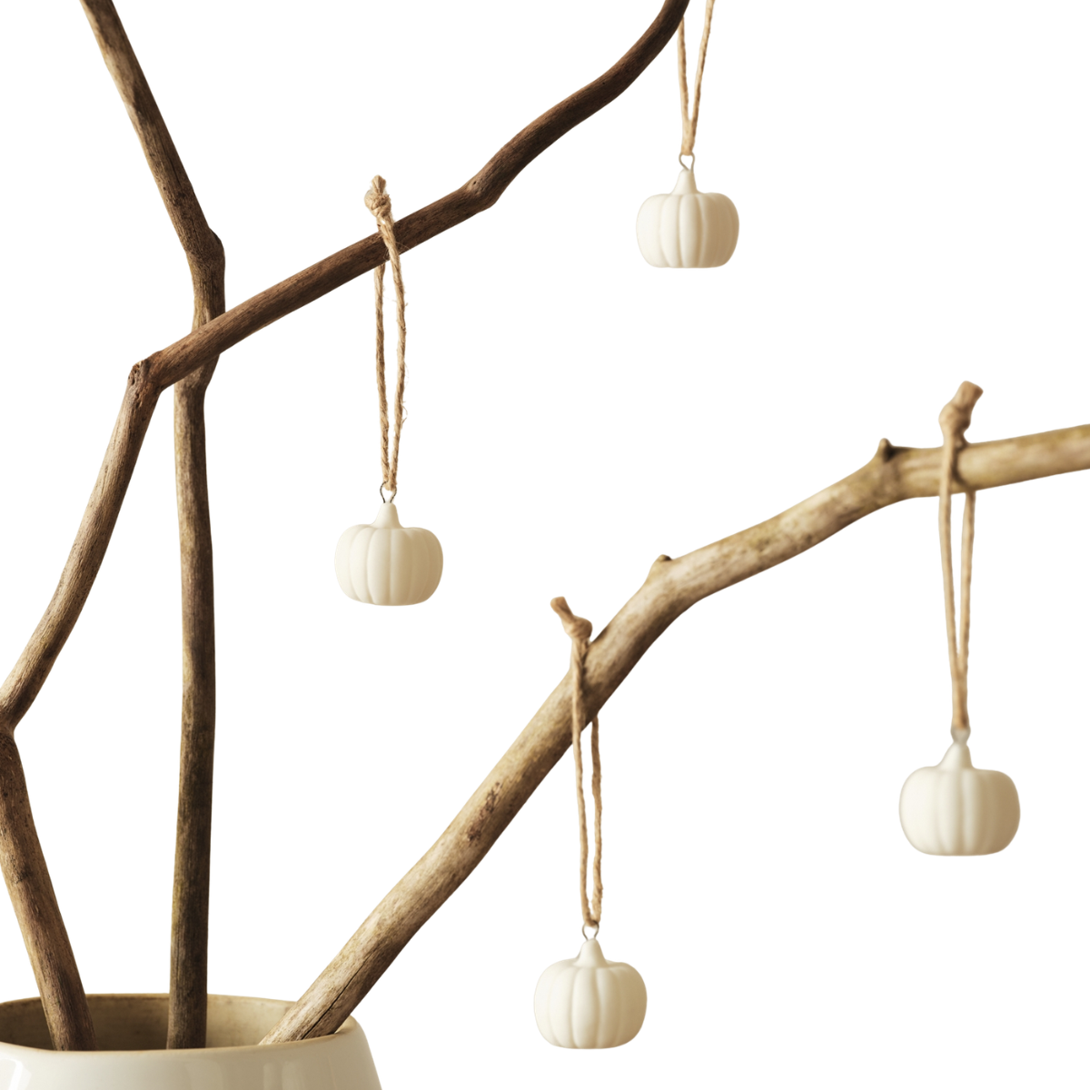 white ceramic pumpkins decorations on twigs