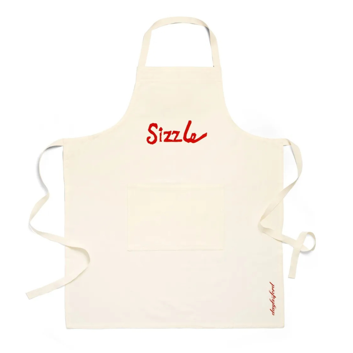 a cream apron with red sizzle writing