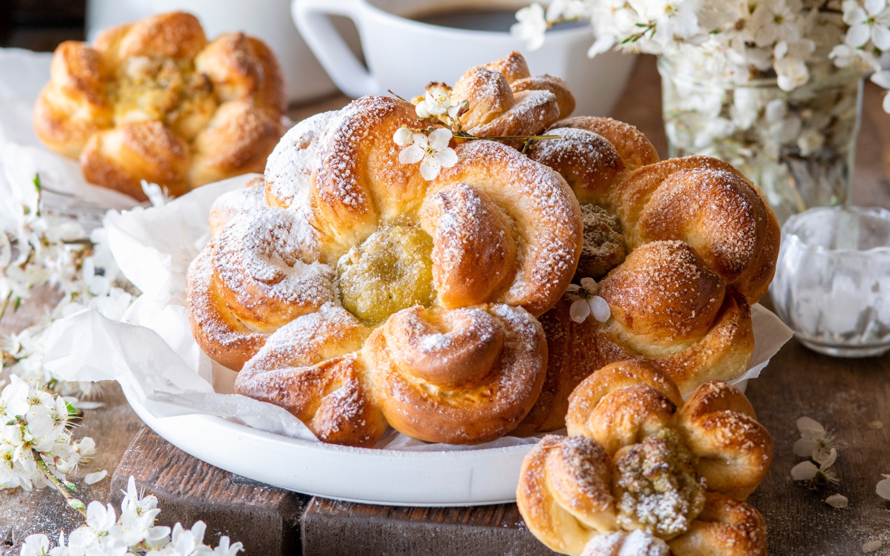 flower shaped buns with white blossoms in the background